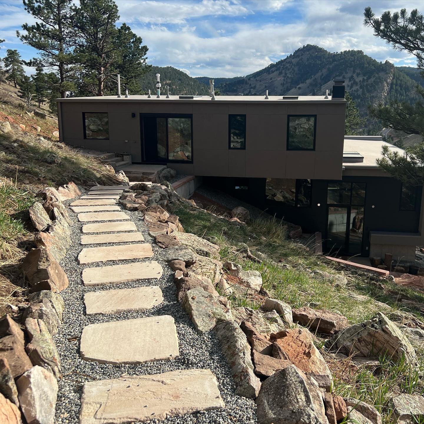 My upper path is finally complete, just in time for the emerging green of Spring! A winter project, the upper path now leads from the top floor out along the hillside to a special outdoor hot tub area where it then hooks into the hiking trails I&rsqu