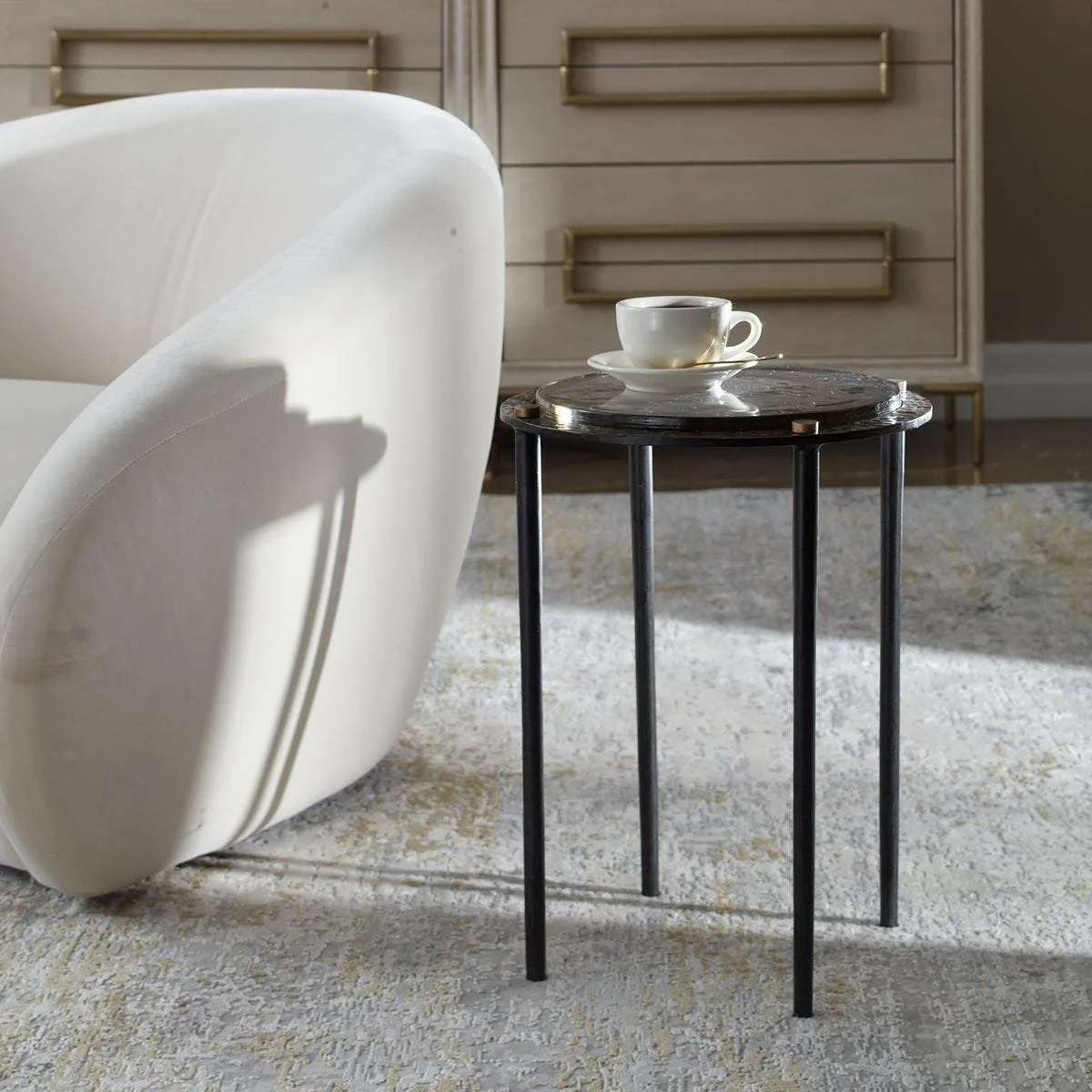 Cast glass accent table styled on a side table as a decorative and functional piece