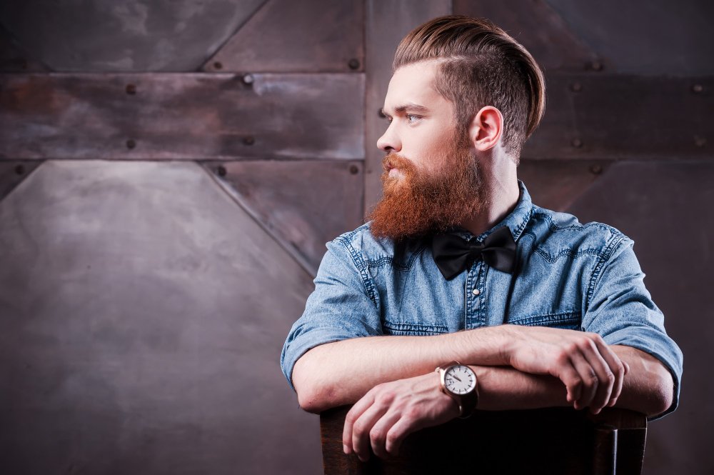 Pompadour-confident-his-perfect-style-profile-handsome-young-bearded-man-looking-away-sitting-chair.jpeg