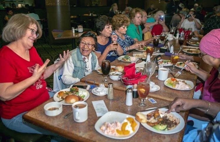  Norma Jean Don, second from left, chats with Carmen Sainz, left, during lunch with a table full of students Don taught at John Spring Junior High in the 1960s. The group meets to eat and do a little gambling at a Tucson-area casino. Ron Medvescek / 