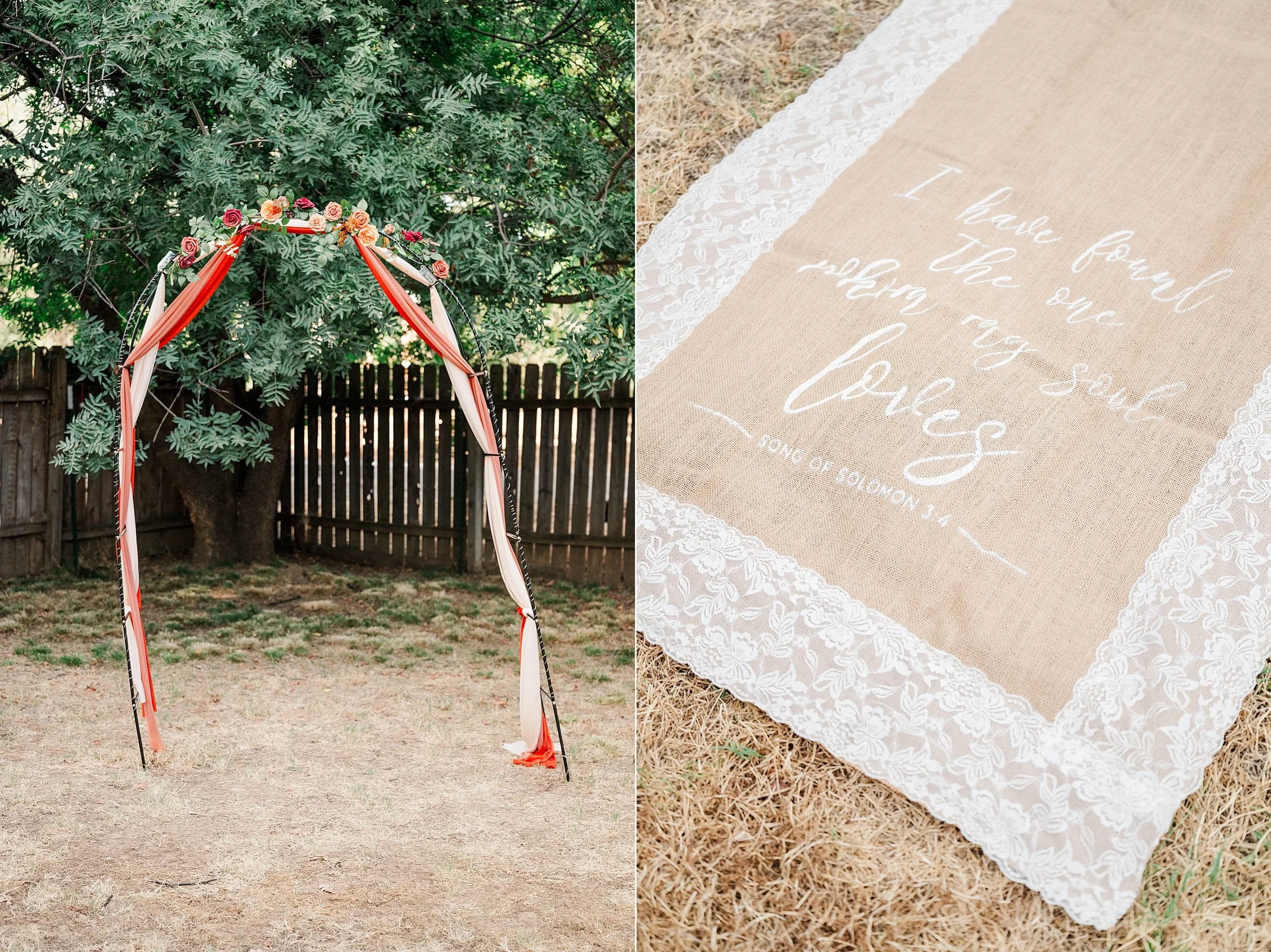 Outdoor wedding scene with a rustic floral arch draped in red ribbons beside a lace-trimmed burlap aisle runner bearing a romantic message.