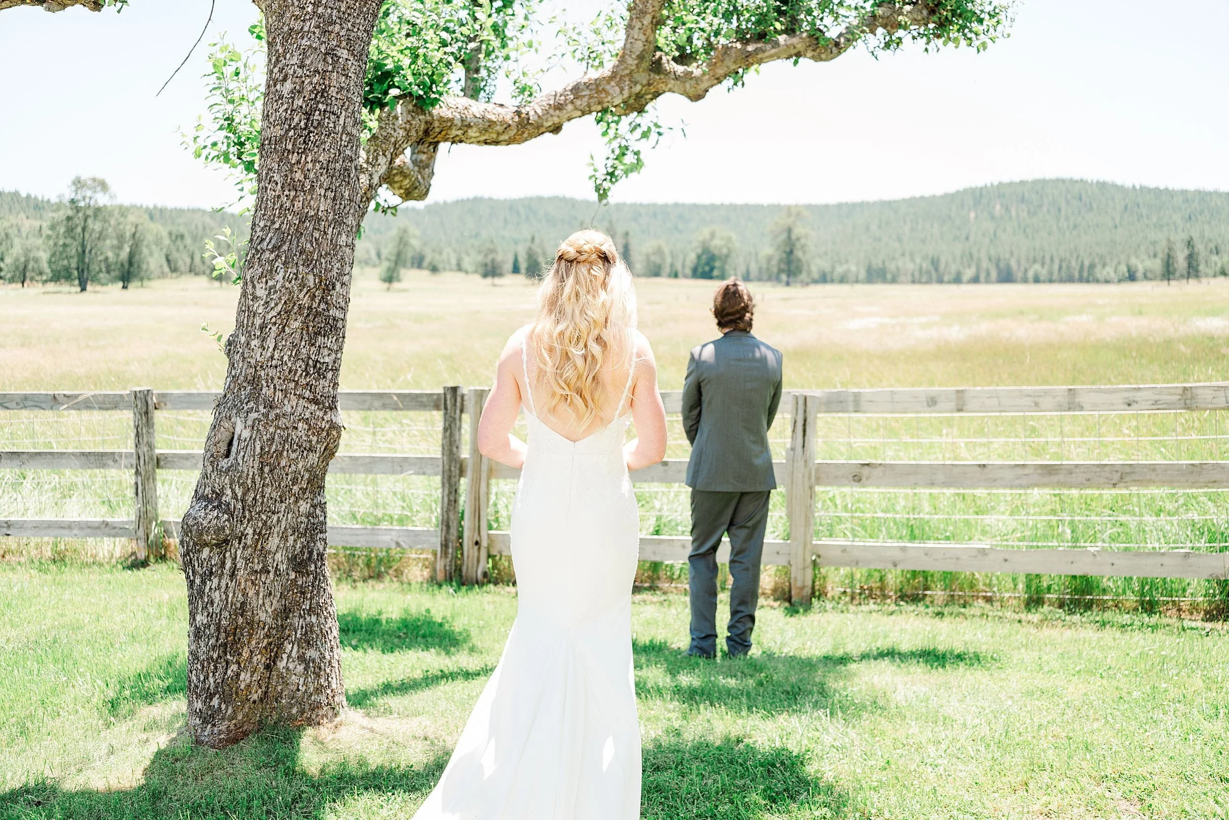 Bride and groom sharing their first look on a private family ranch.