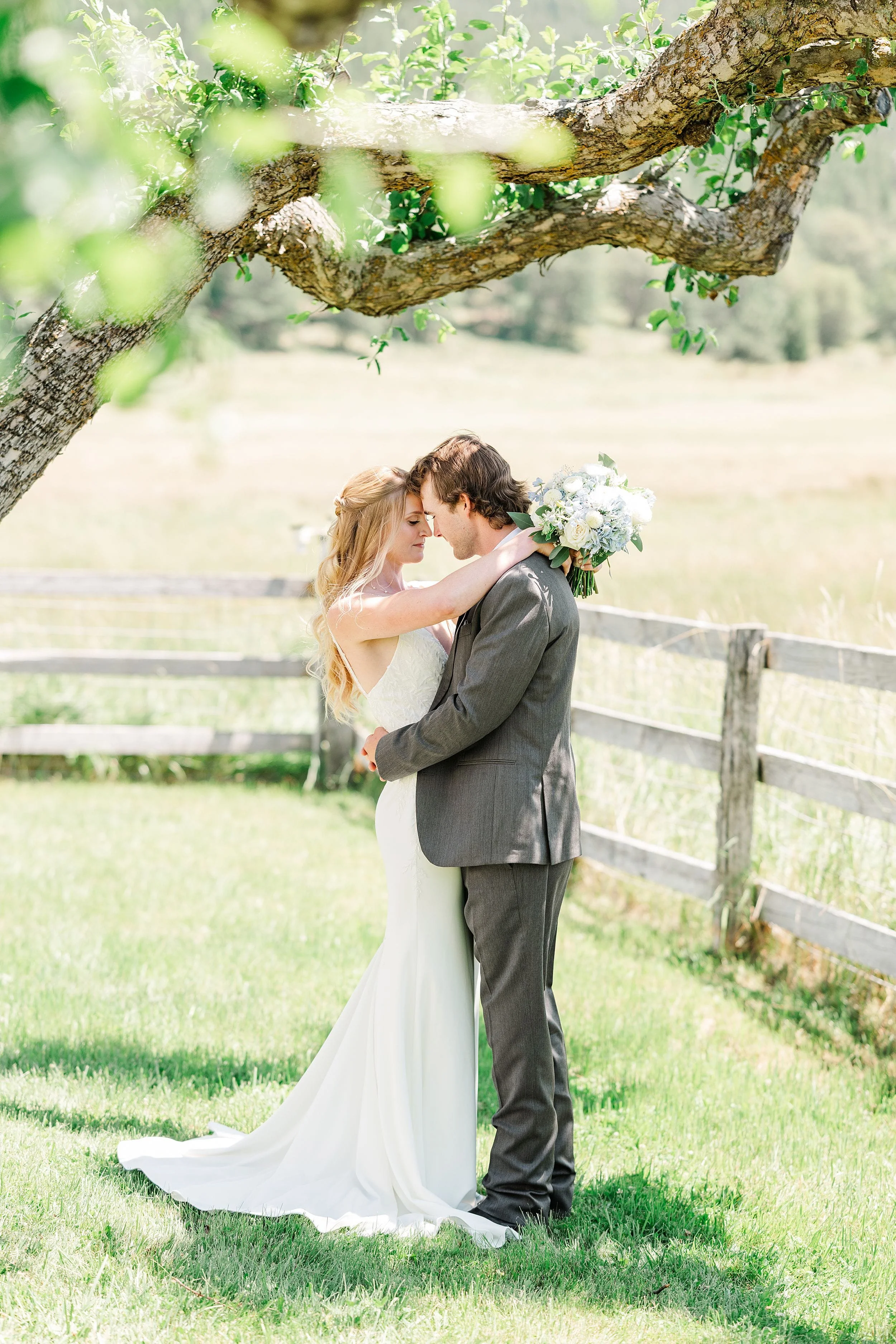 Bride and groom embracing during their first look in the mountains.