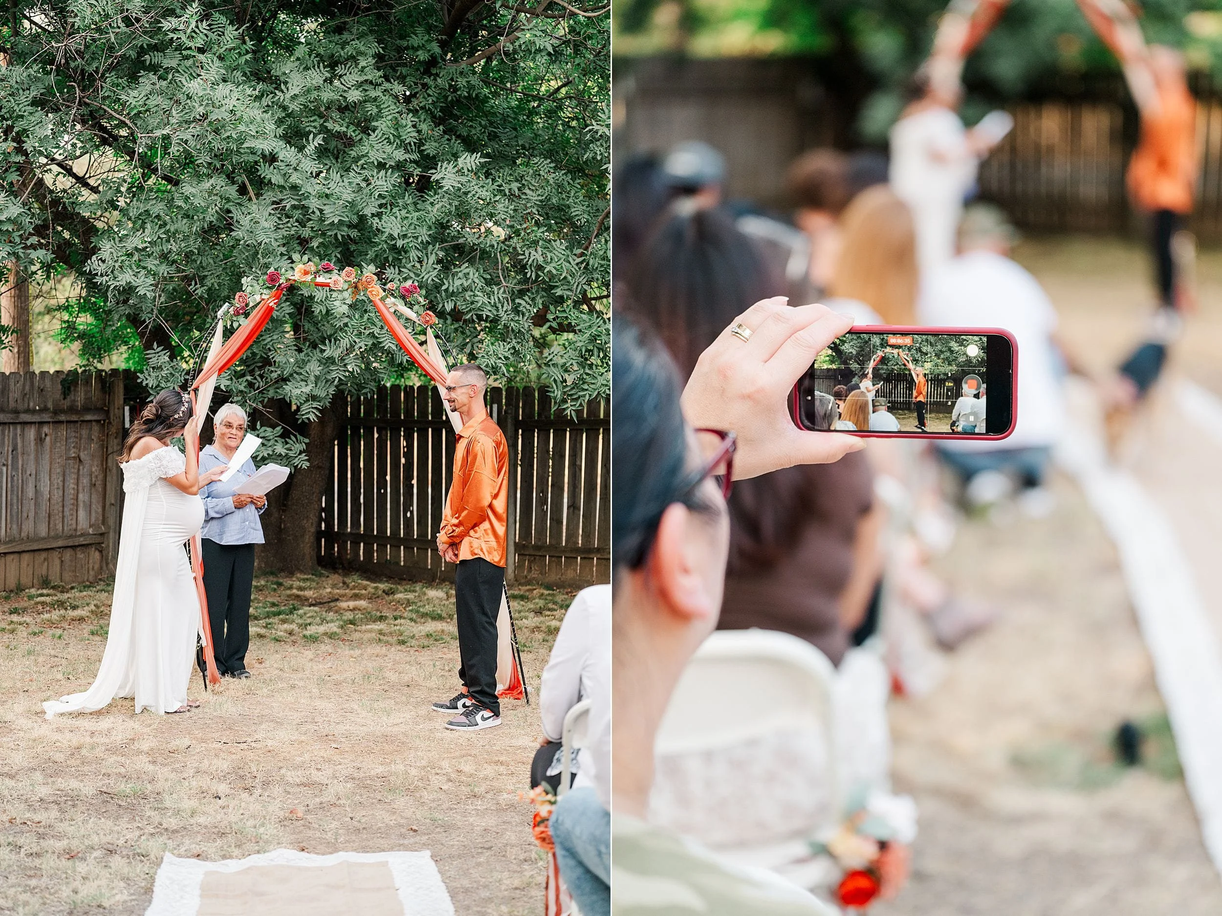 Outdoor wedding ceremony under a floral arch; bride, officiant, and groom hold ribbons while a guest records the joyful moment on a phone.