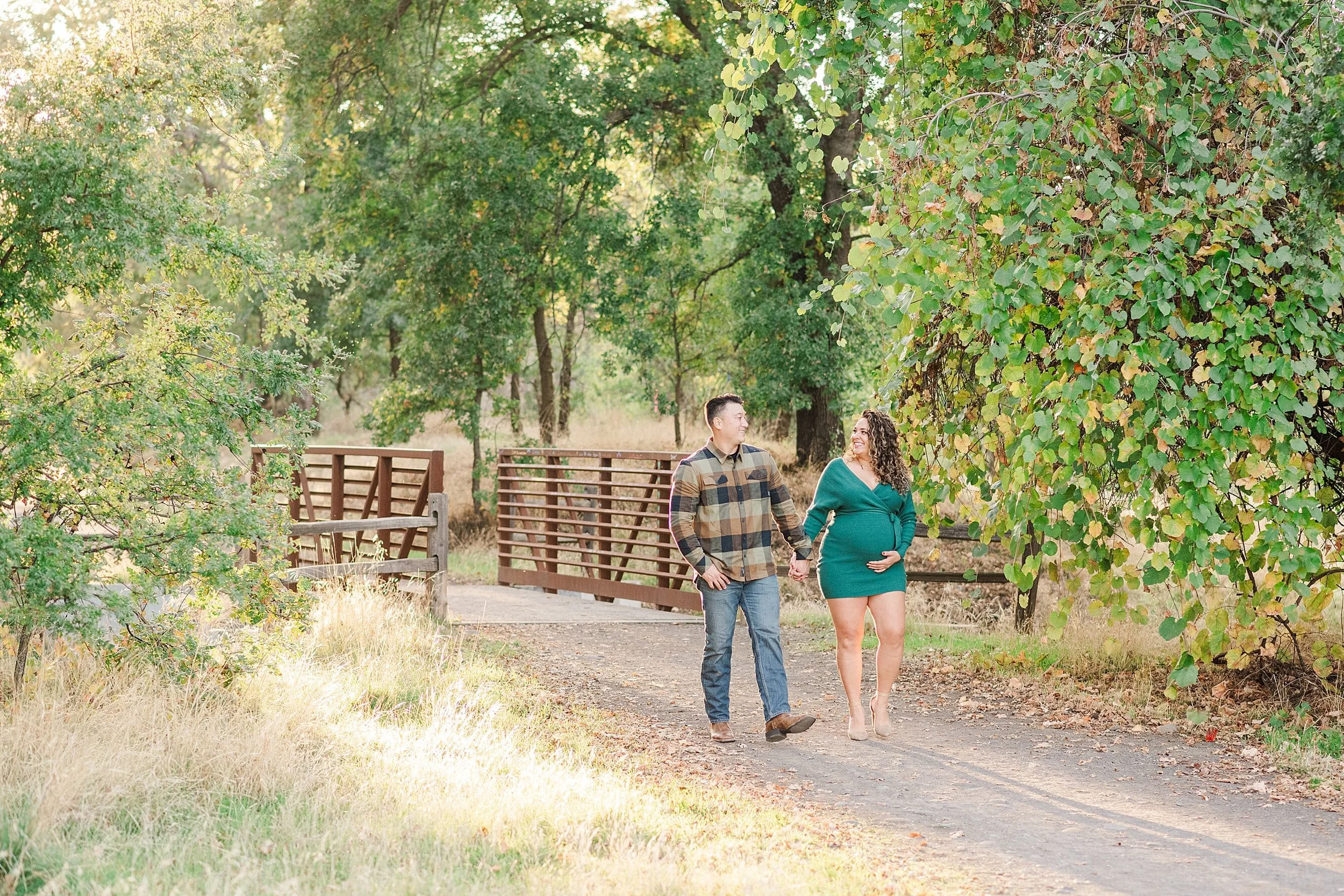 married couple walking down path in verbena fields