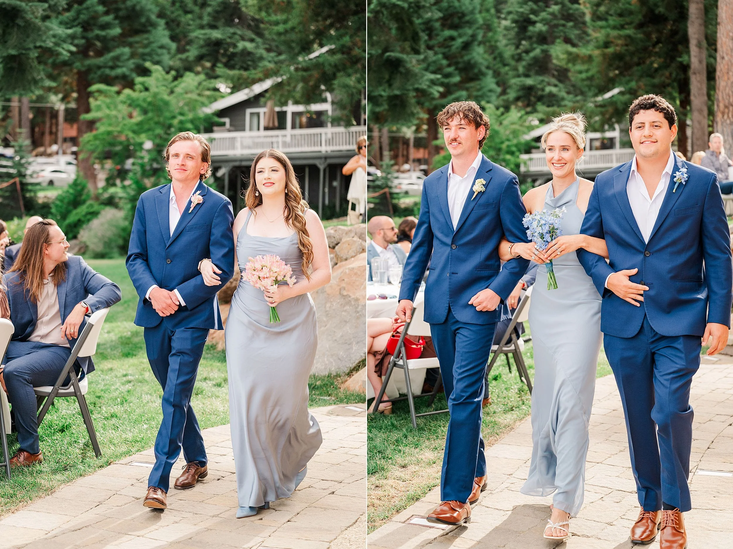 Wedding party walks along a garden path beside a forest lodge, with men in navy suits and women in gray dresses carrying bouquets.