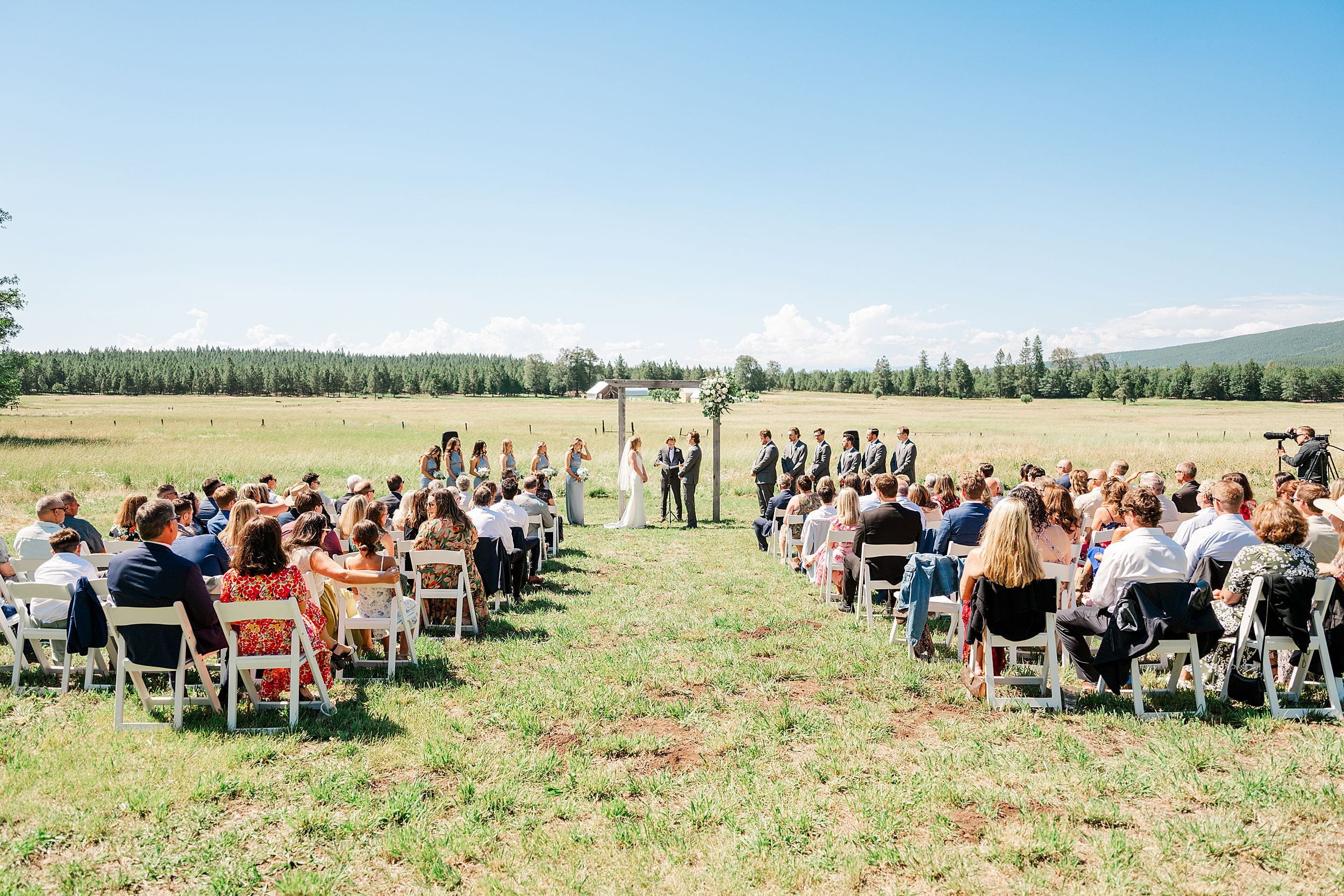 Wedding ceremony overlooking the mountains on a private family ranch.