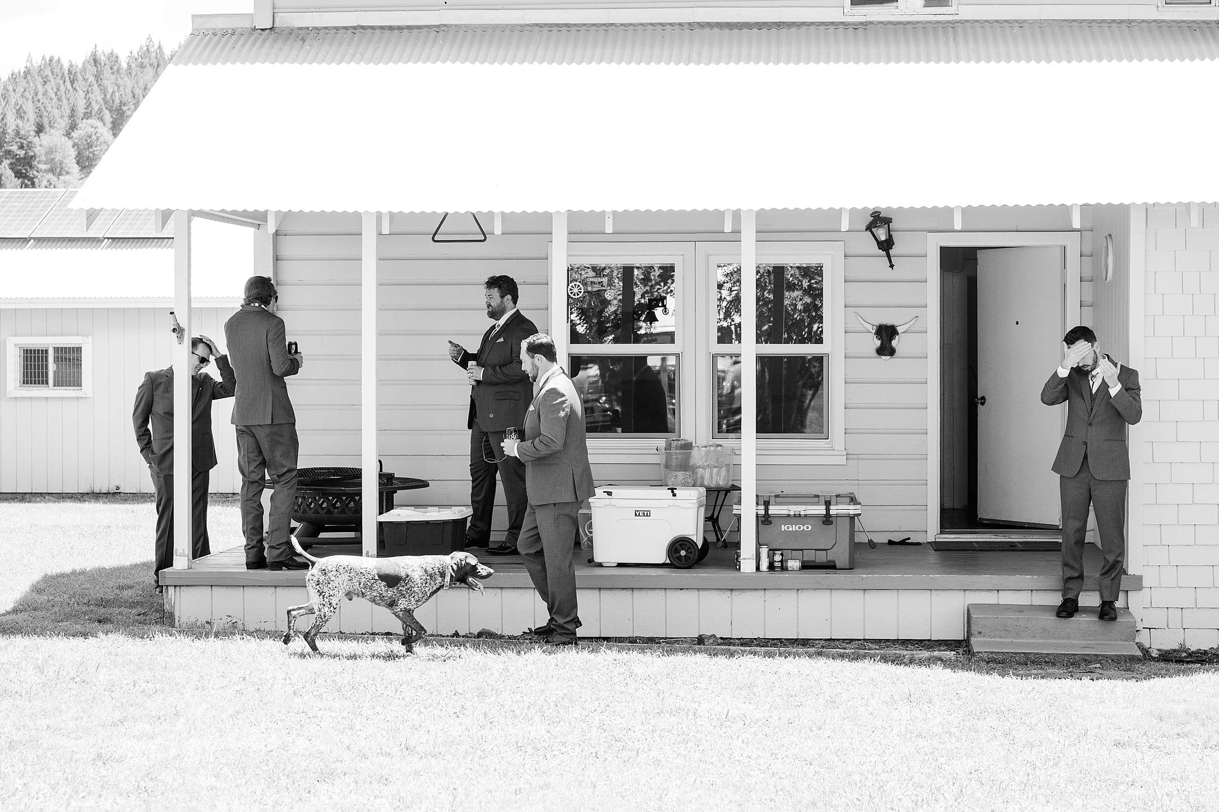 Groomsmen and Groom hanging out at ranch house before wedding ceremony.