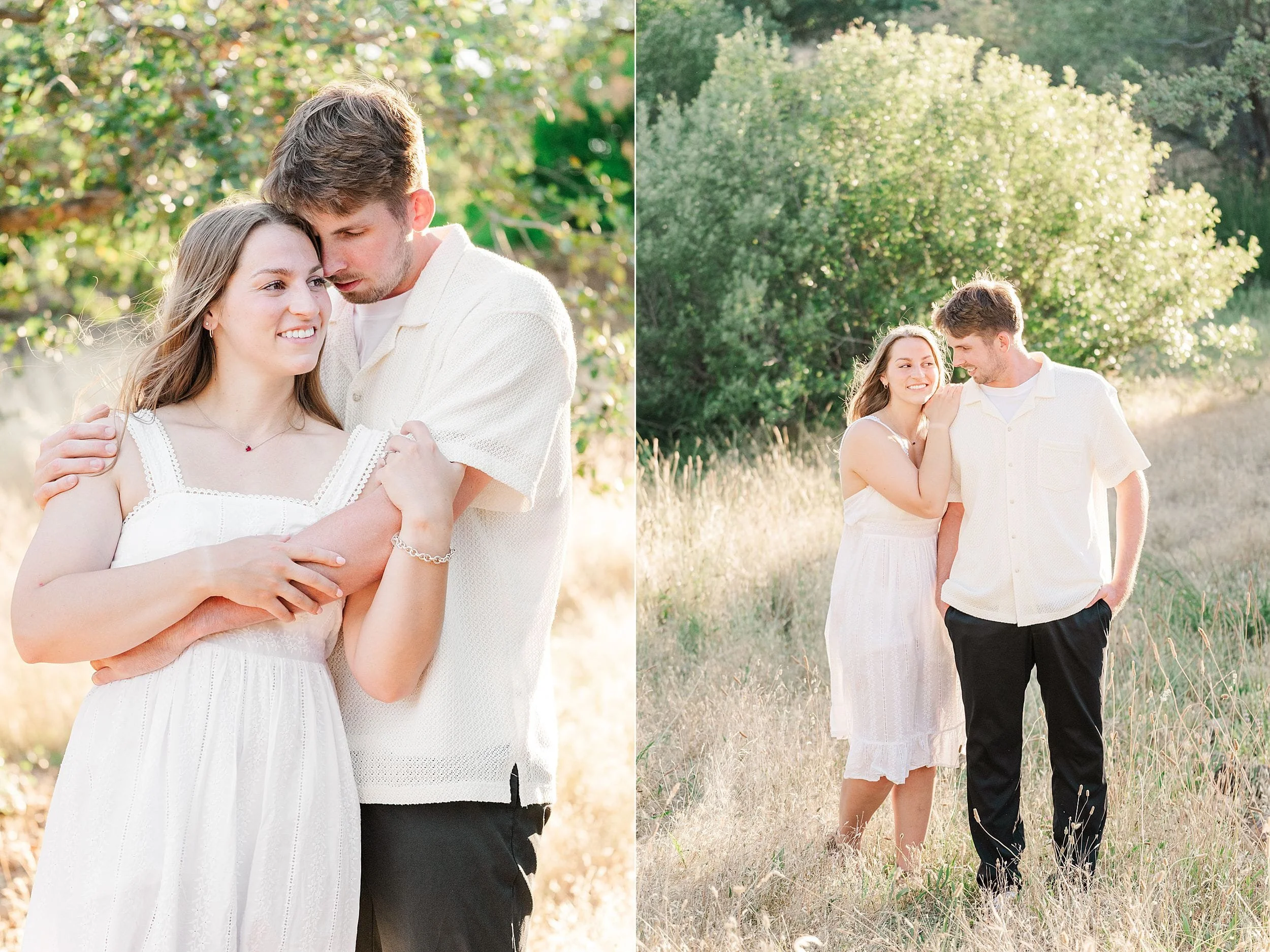 A couple in a sunlit field shares a tender moment. The woman wears a white dress, the man a cream shirt. They exude happiness and warmth together.
