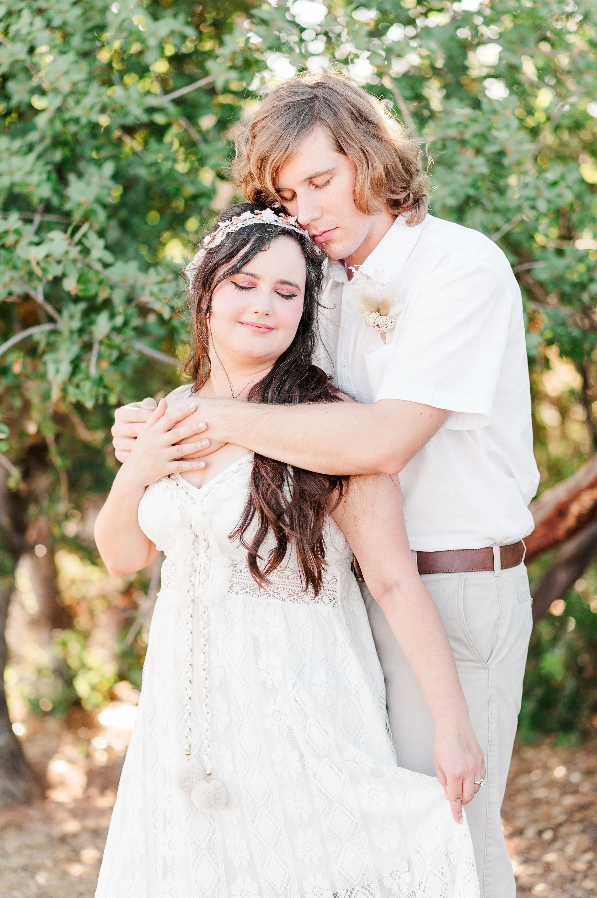 man hugging fiance from behind