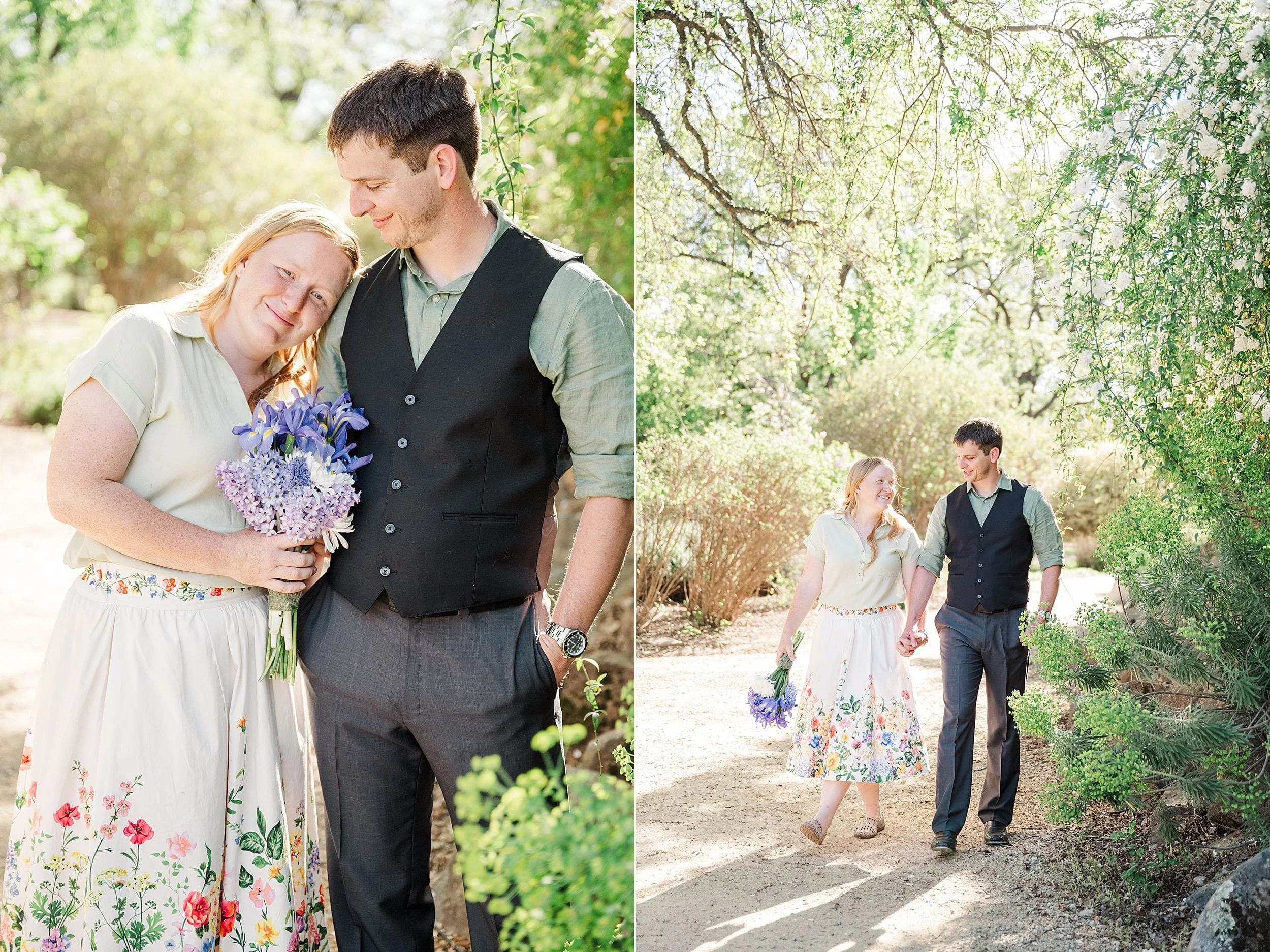 A couple walks hand in hand through a sunlit garden. She holds purple flowers, wearing a floral skirt, while he wears a vest, both appearing content and happy.