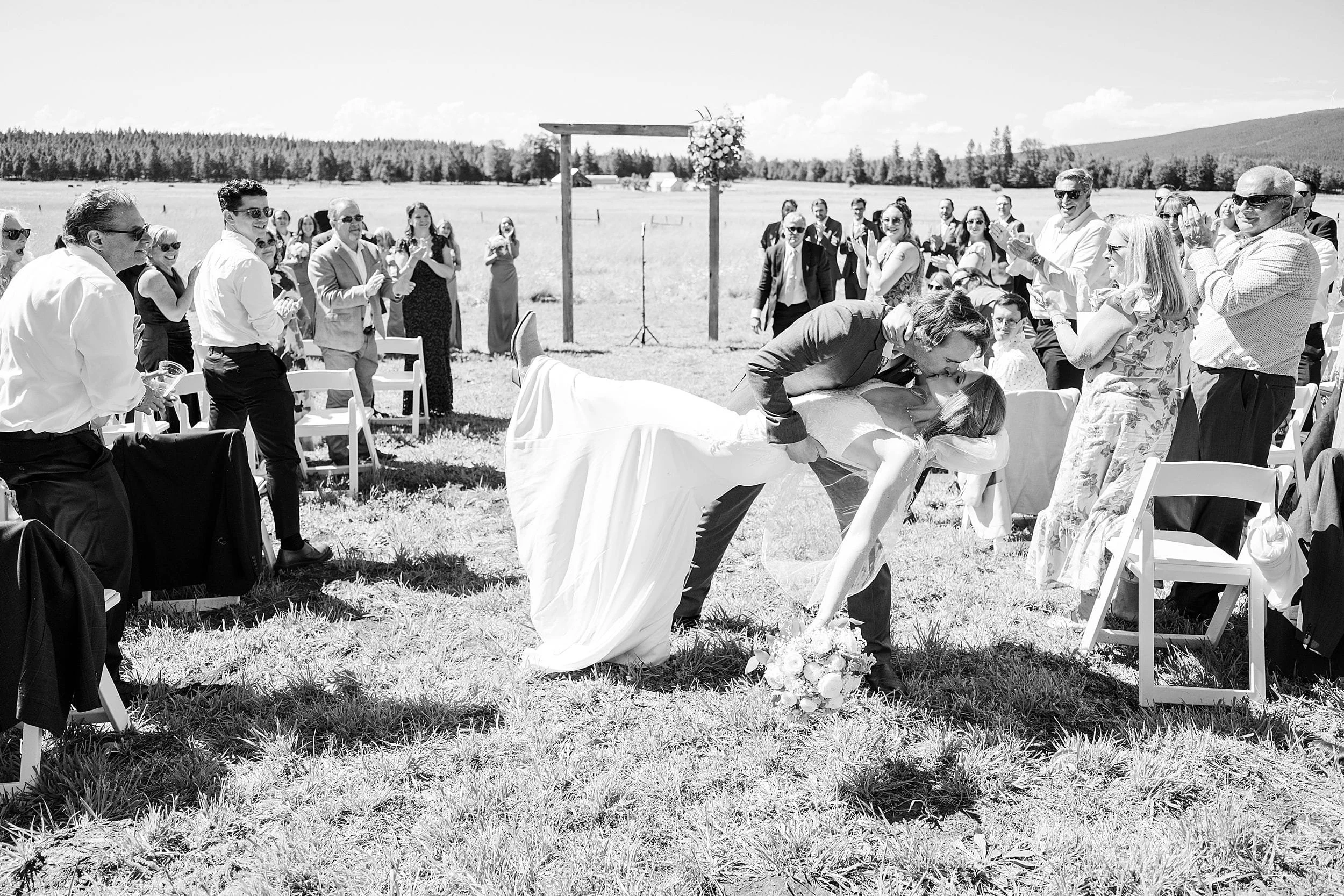 Newly married couple walking back down the aisle after their ceremony.