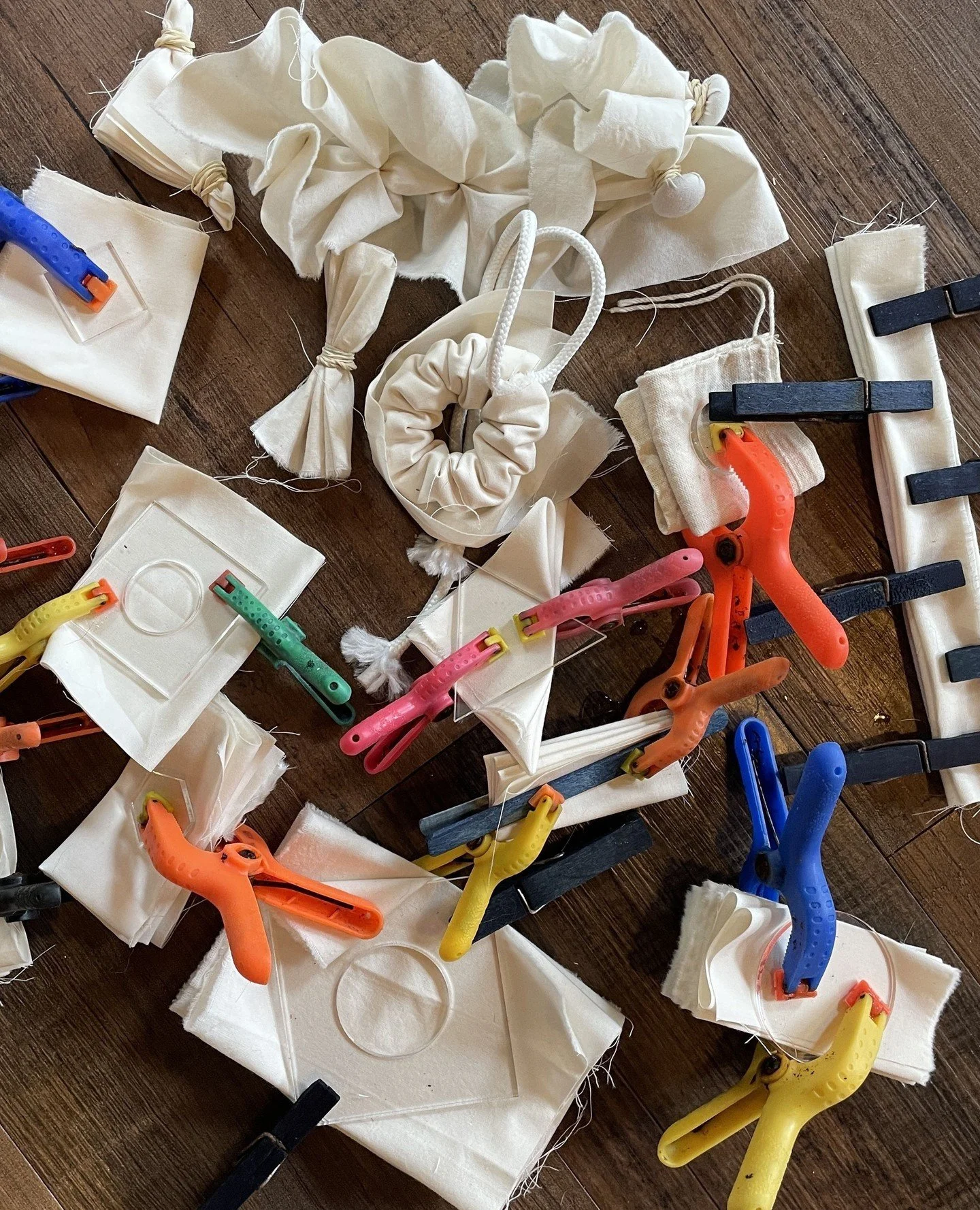 I use undyed muslin for so many things in my studio so I keep a basket on thee counter for scraps. It's been overflowing for quite a while now so it's time to dye them up. These are all prepped for the indigo vat.⁠