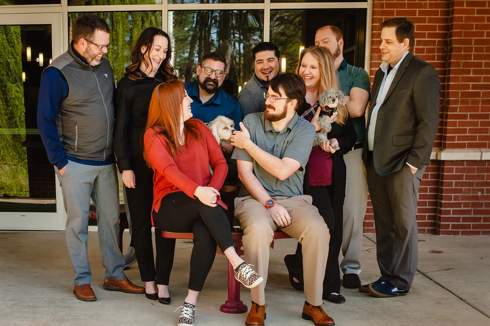 the Ozark team looking at their dog