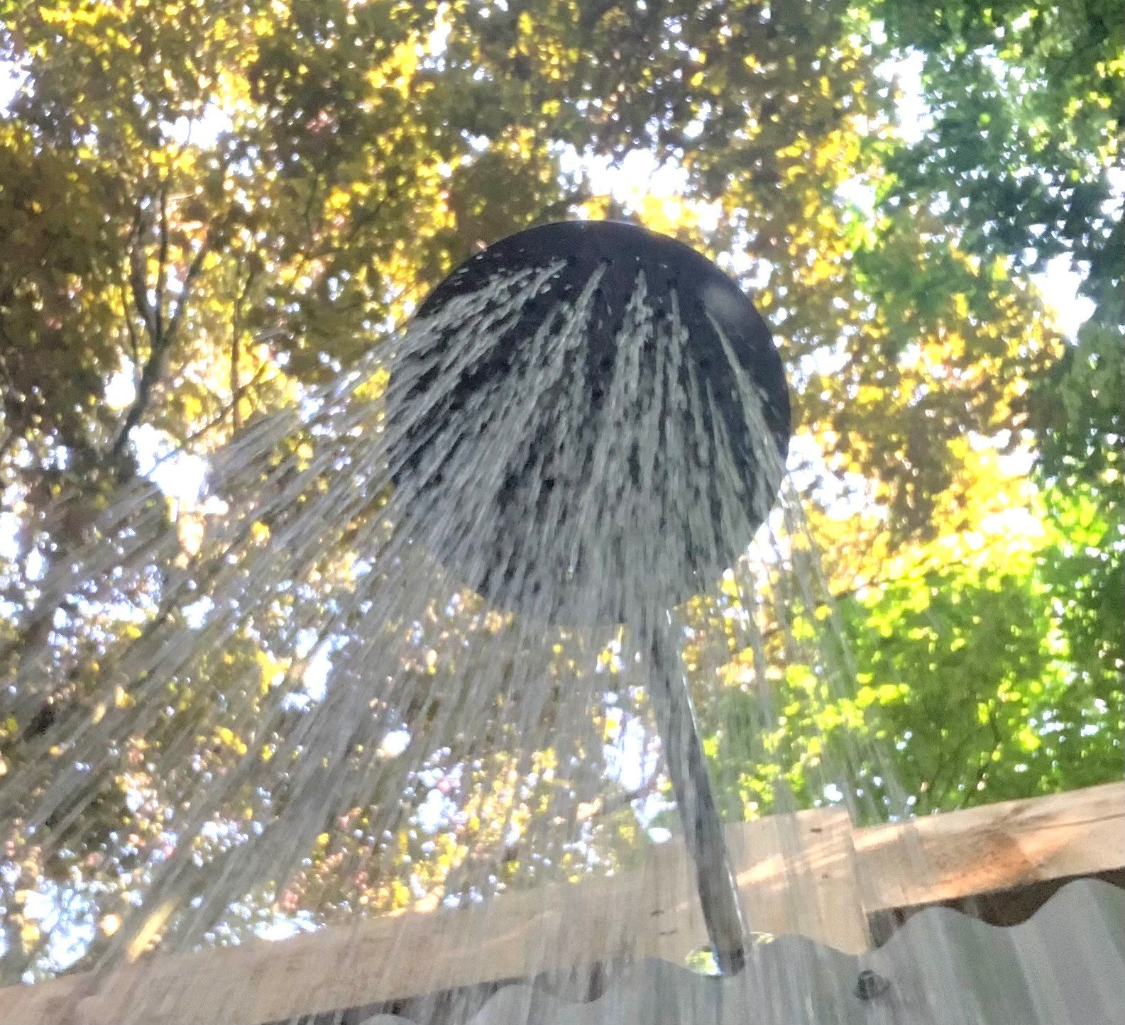 Hot shower under the trees