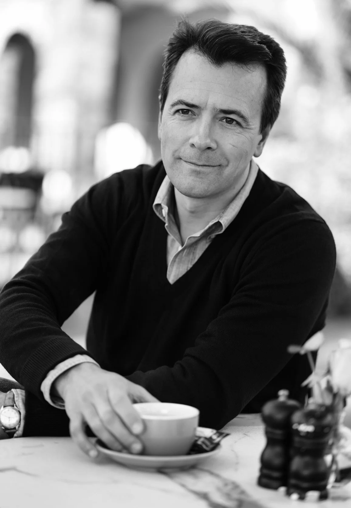 Dating profile photo of a man in a cafe