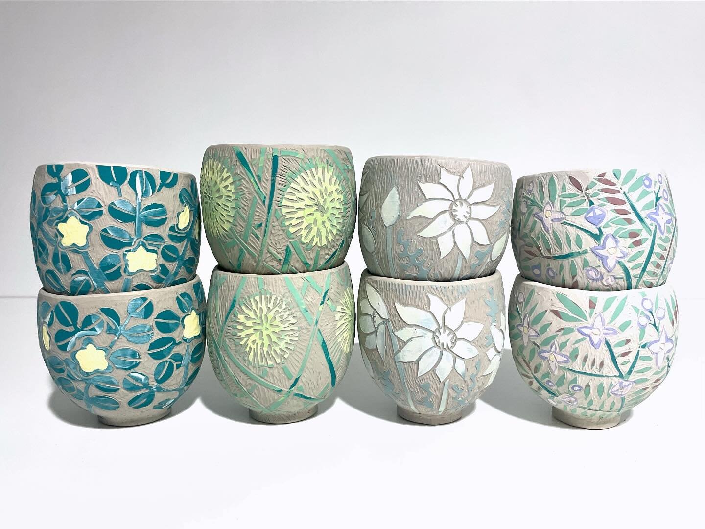 I took a dozen balls of clay, a box of tools and my banding wheel to Gulgong last week, and made cups while watching master demonstrations. (Others knit, I pinch clay 😂) Back in the studio this week, I&rsquo;ve painted and carved the cups, and now t
