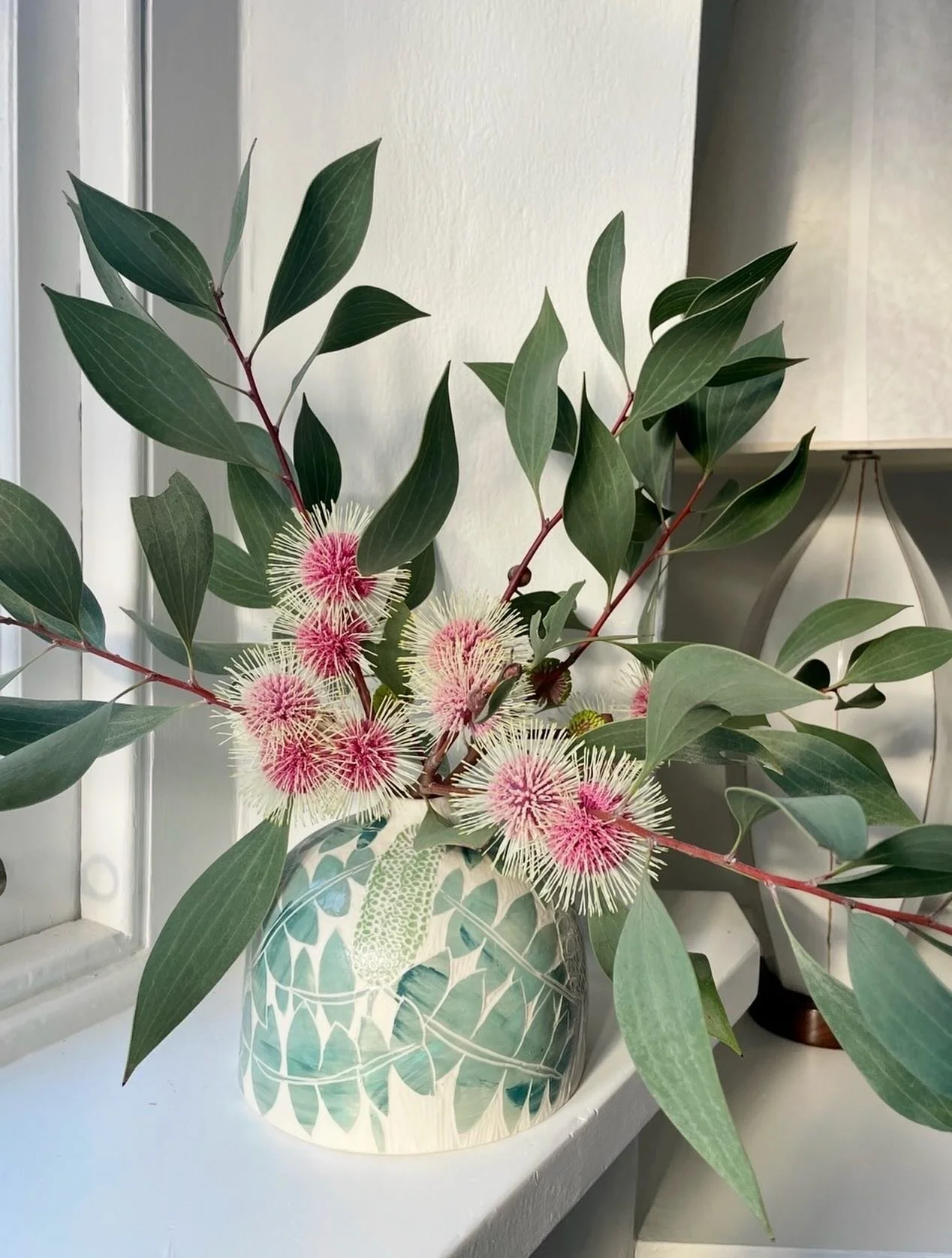 The first week of May might mean other things for fashionistas, Star Wars fans and unionists, but for the birds in my backyard it&rsquo;s all about the Pincushion Hakeas coming into bloom. 

Shown here in a vase featuring Giant Banksia &mdash; a fell
