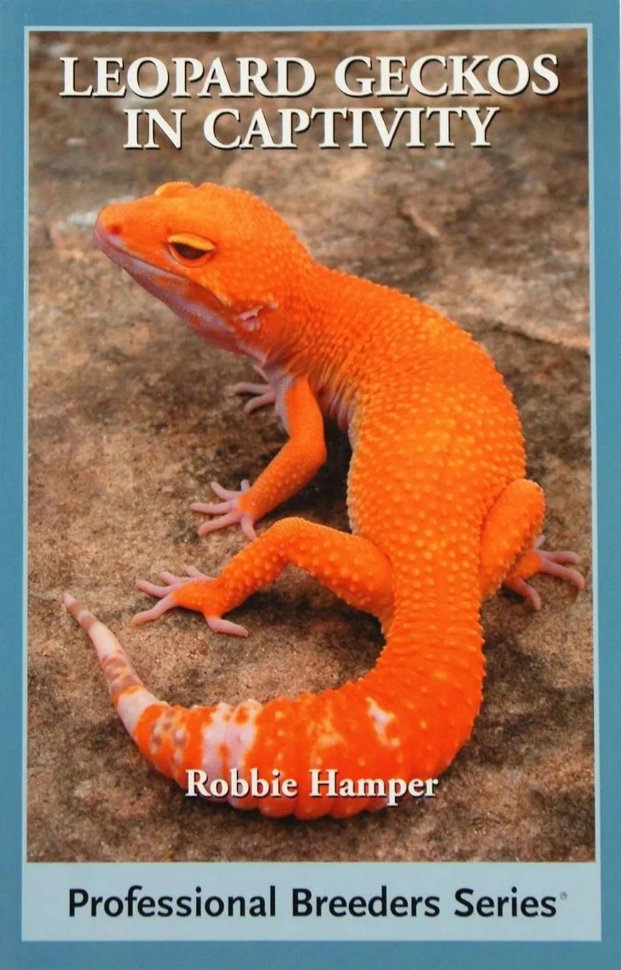 Book cover titled 'Leopard Geckos in Captivity' featuring an orange leopard gecko on a rocky background, by Robbie Hamper, part of the Professional Breeders Series.
