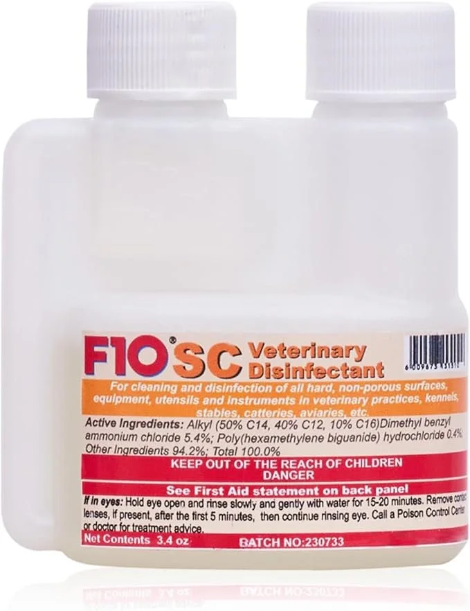 white bottle of F10 SC Veterinary Disinfectant on a plain background.