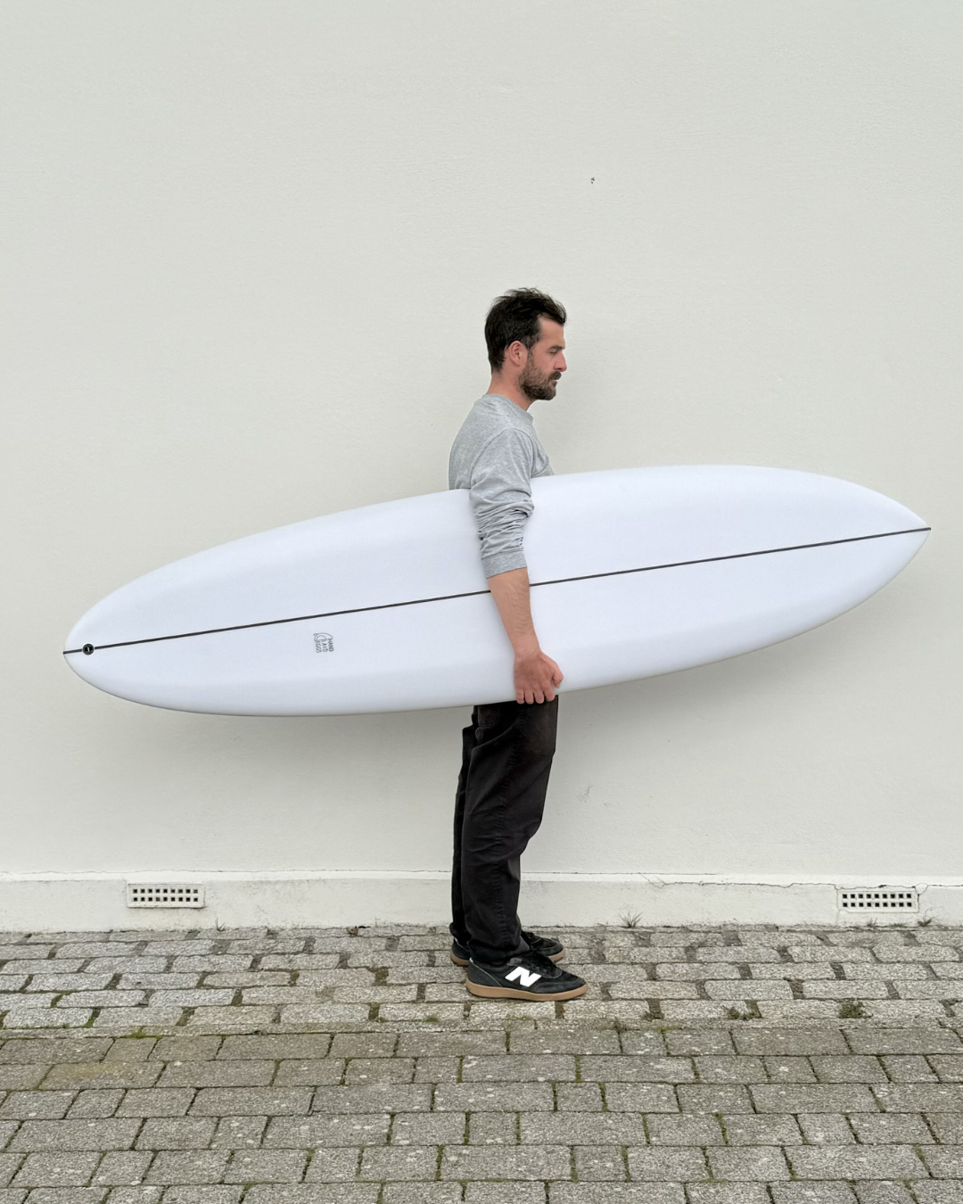 twin-pin-midlength-surfboard.png