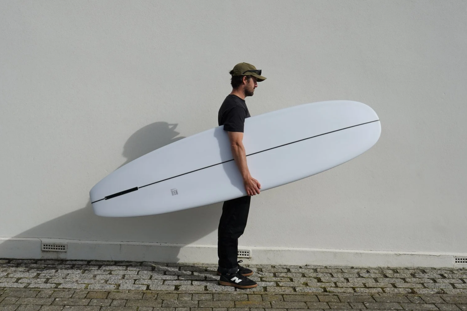 white single fin surfboard mini longboard styled