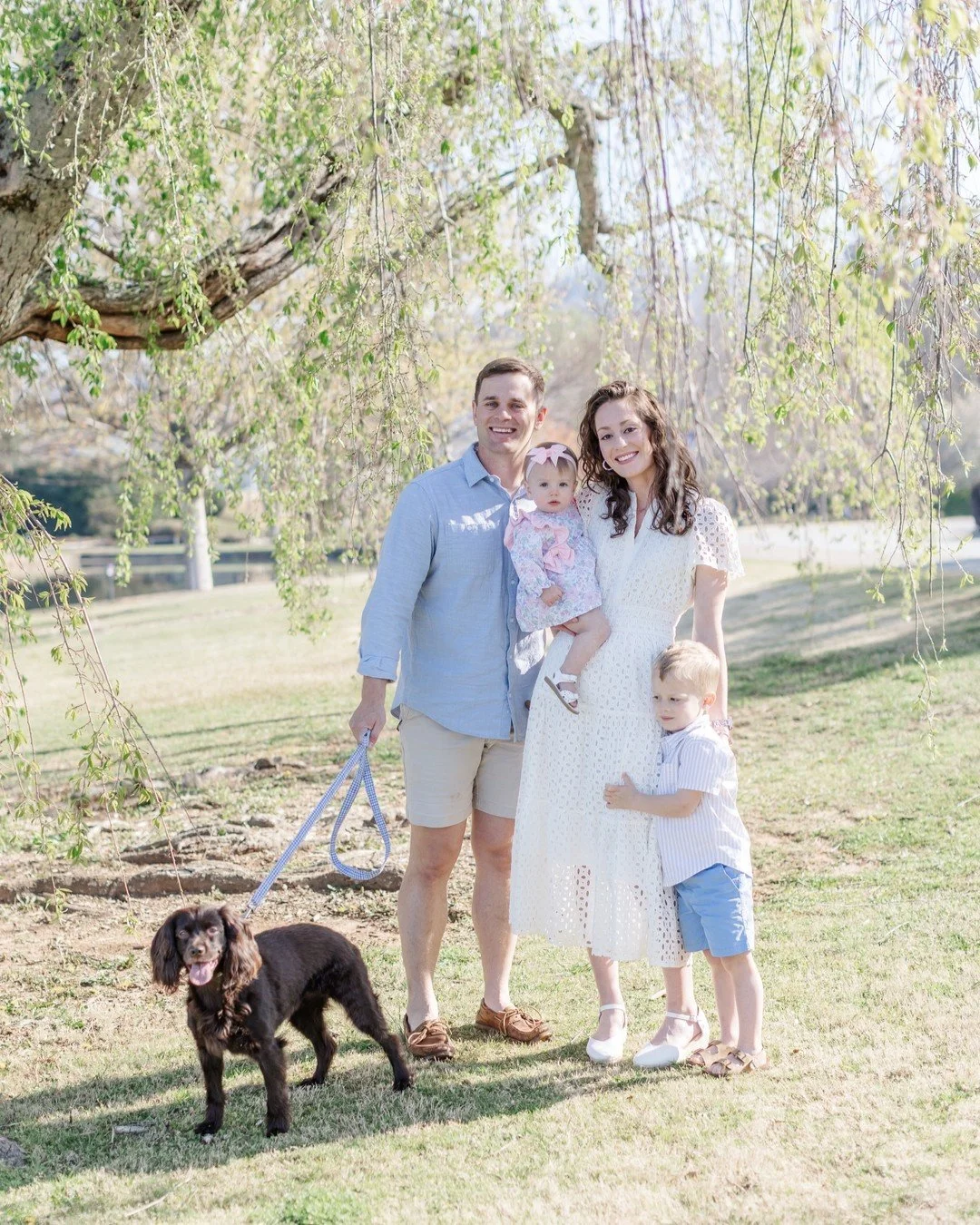 Yes, we absolutely bring the dog. 🐾
This is what a spring family session in Upstate South Carolina looks like &mdash; golden light, a weeping willow, two kids, one very happy pup, and a family that just fits together. If you've been looking for a Gr