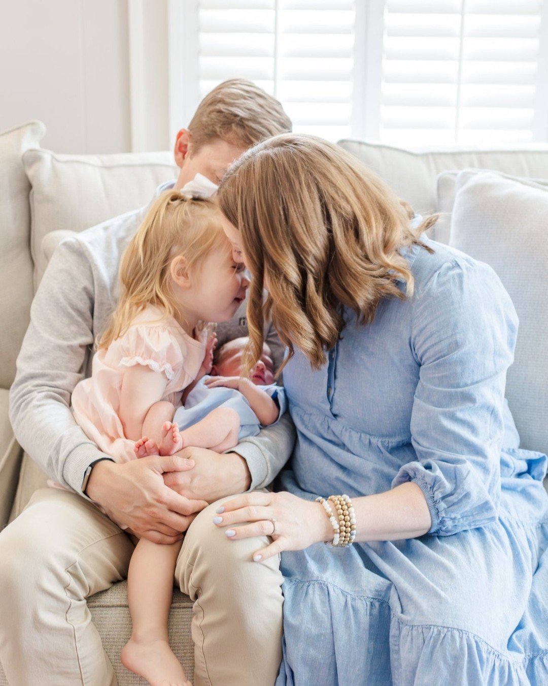 If you're looking for a Greenville newborn photographer who's going to capture this &mdash; the real stuff, the big sister moment, the four of you piled on the couch &mdash; that's exactly what I'm here for. 🤍
.
In-home newborn sessions for families