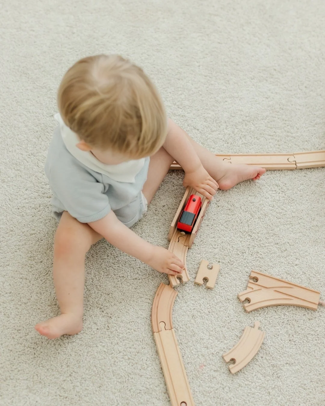 Just a boy and his trains. Completely in his own world. Completely perfect.
.
In-home sessions are some of my favorites because this is real life. Their toys, their space, the way they actually spend their days. 
.
That is worth documenting.
.
Link i
