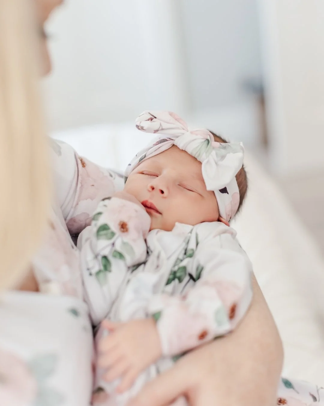 Nine months of waiting. And then, finally, her.
 
I photographed this sweet girl in the window light of her nursery three days after she came home. Her parents had the softest voices. The dog kept sneaking in to check on her. The whole room smelled l