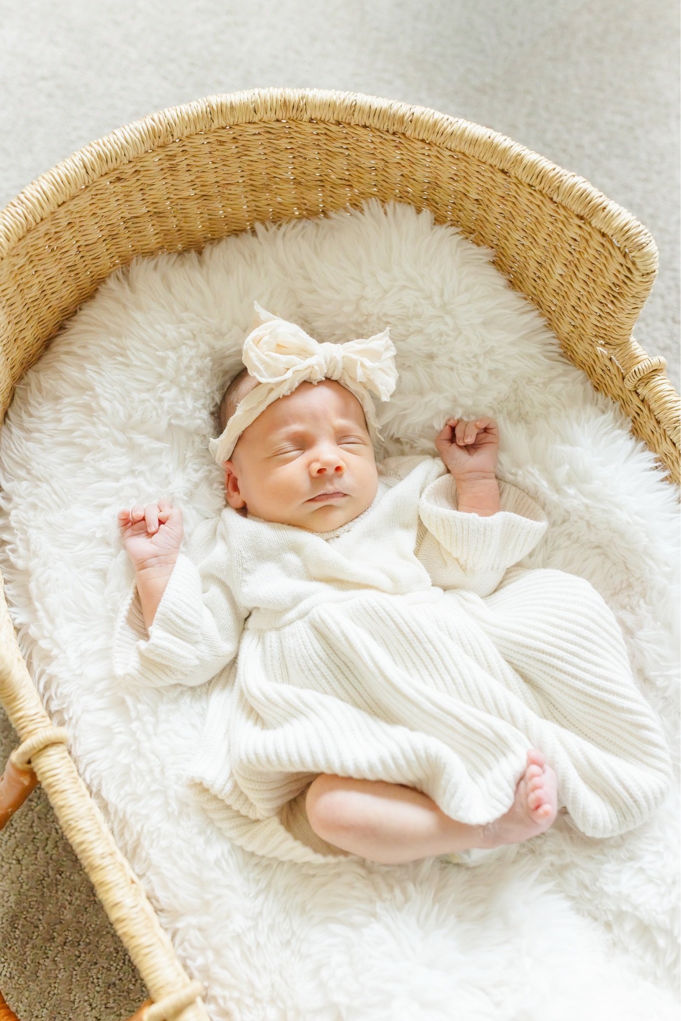 Those stretched-out fists and that sleepy little face get me every time. 🤍 This is exactly the kind of cozy, unhurried moment we capture during at-home newborn sessions, right in the space you've already made ready for baby.

If you're due winter or