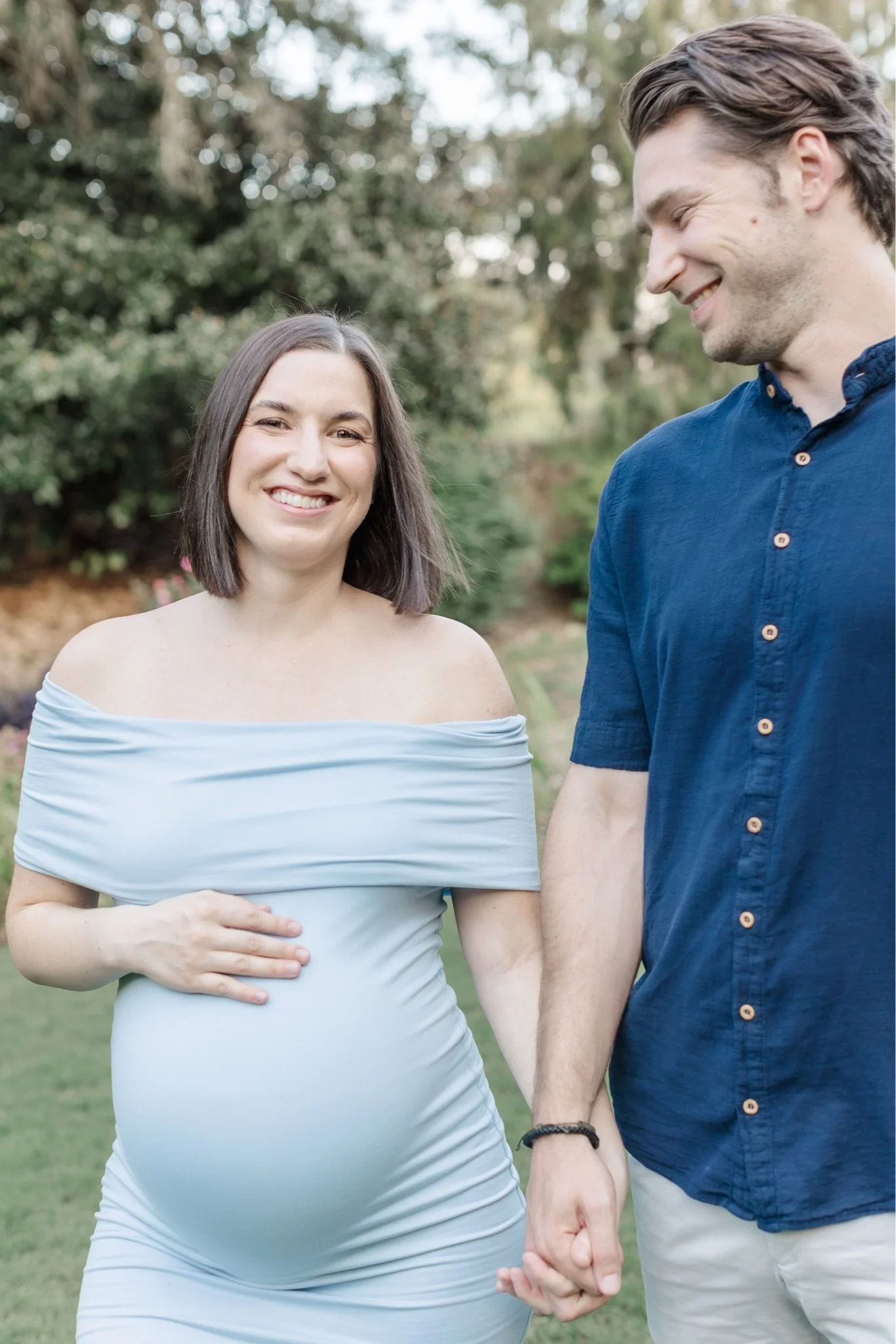 This one's giving happy, glowing, and very ready to meet this baby. 💙 I love catching those little in between moments during maternity sessions, the looks, the hand holding, the way you two do this whole thing together.