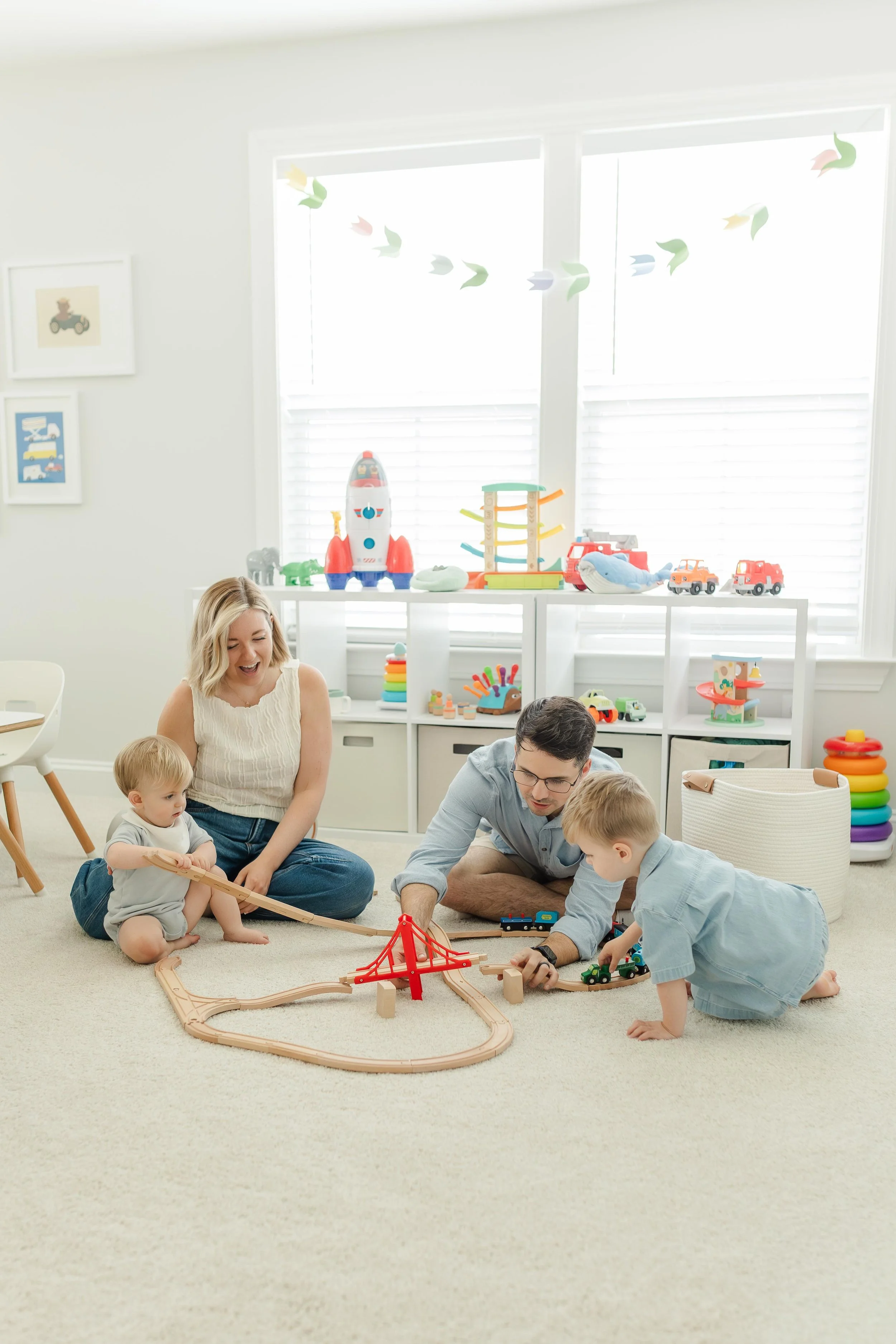 family at home in simpsonville south carolina playing with trains for lifestyle at home family session