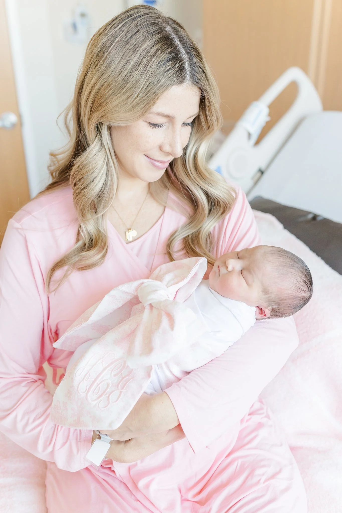 mom holding newborn baby at hospital in greenville south carolina