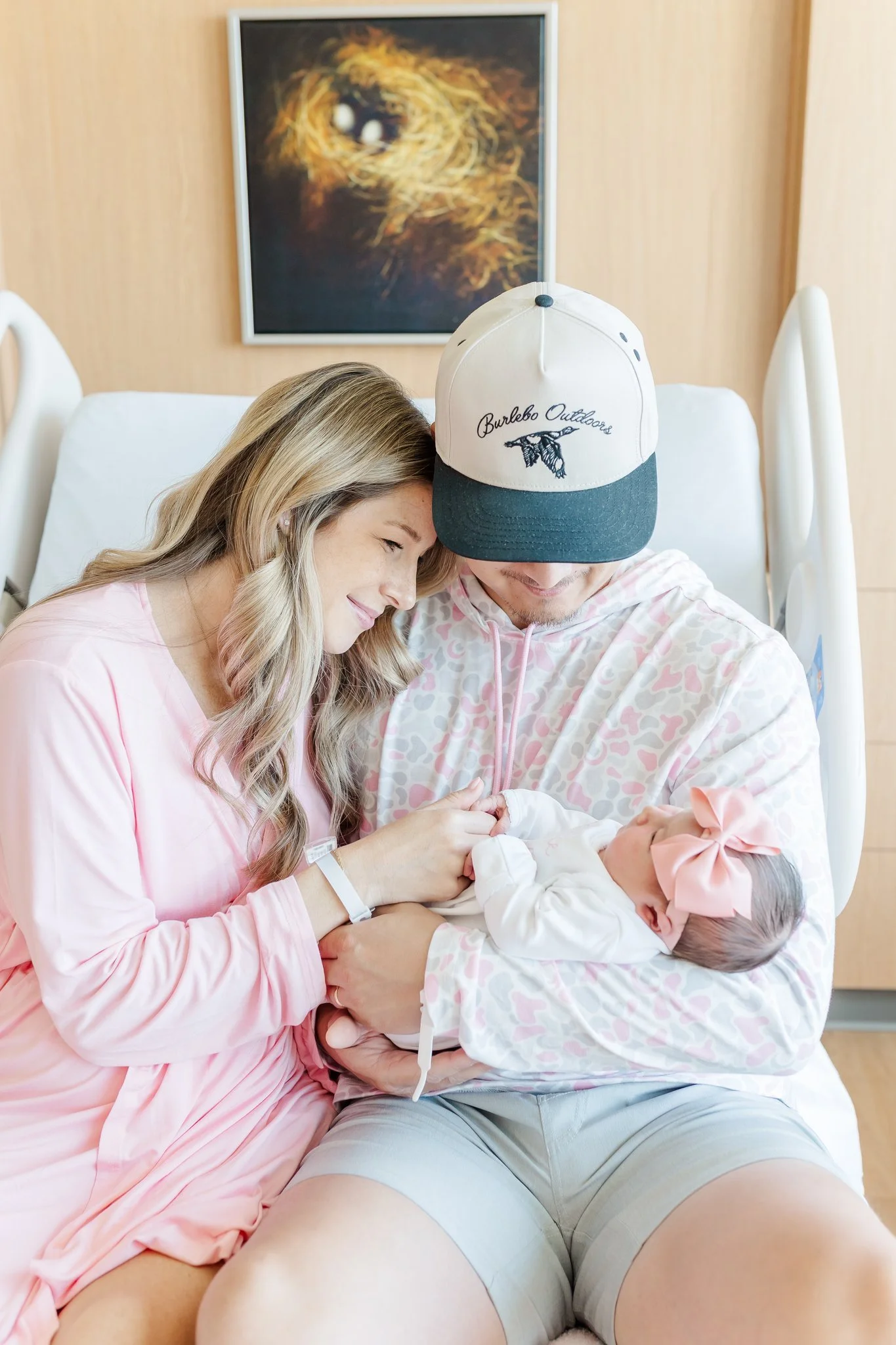 greenville south carolina hospital newborn photography mom, dad and baby in hospital bed at patewood hospital