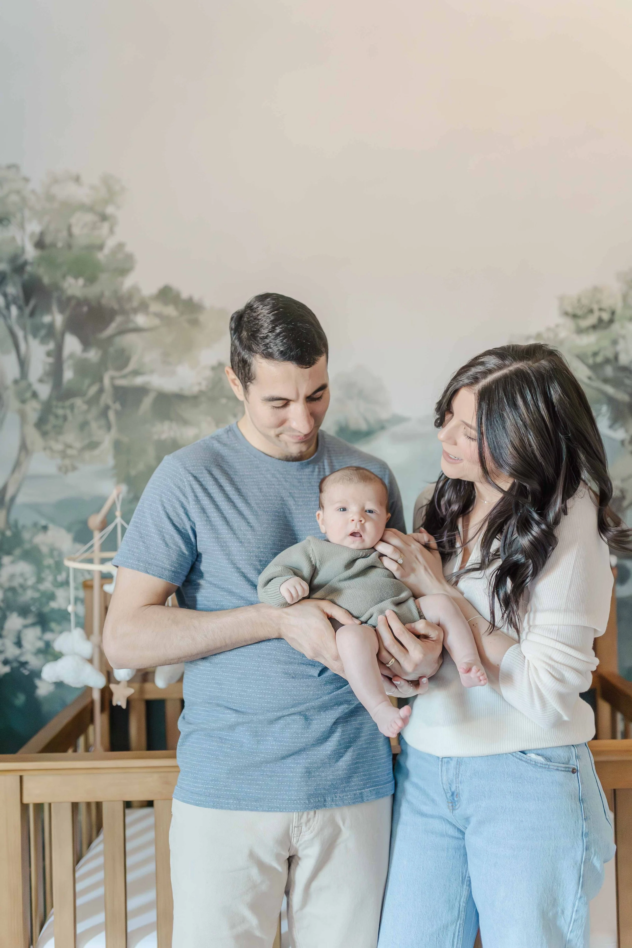New parents with newborn baby in woodland nursery, in-home newborn session Piedmont SC
