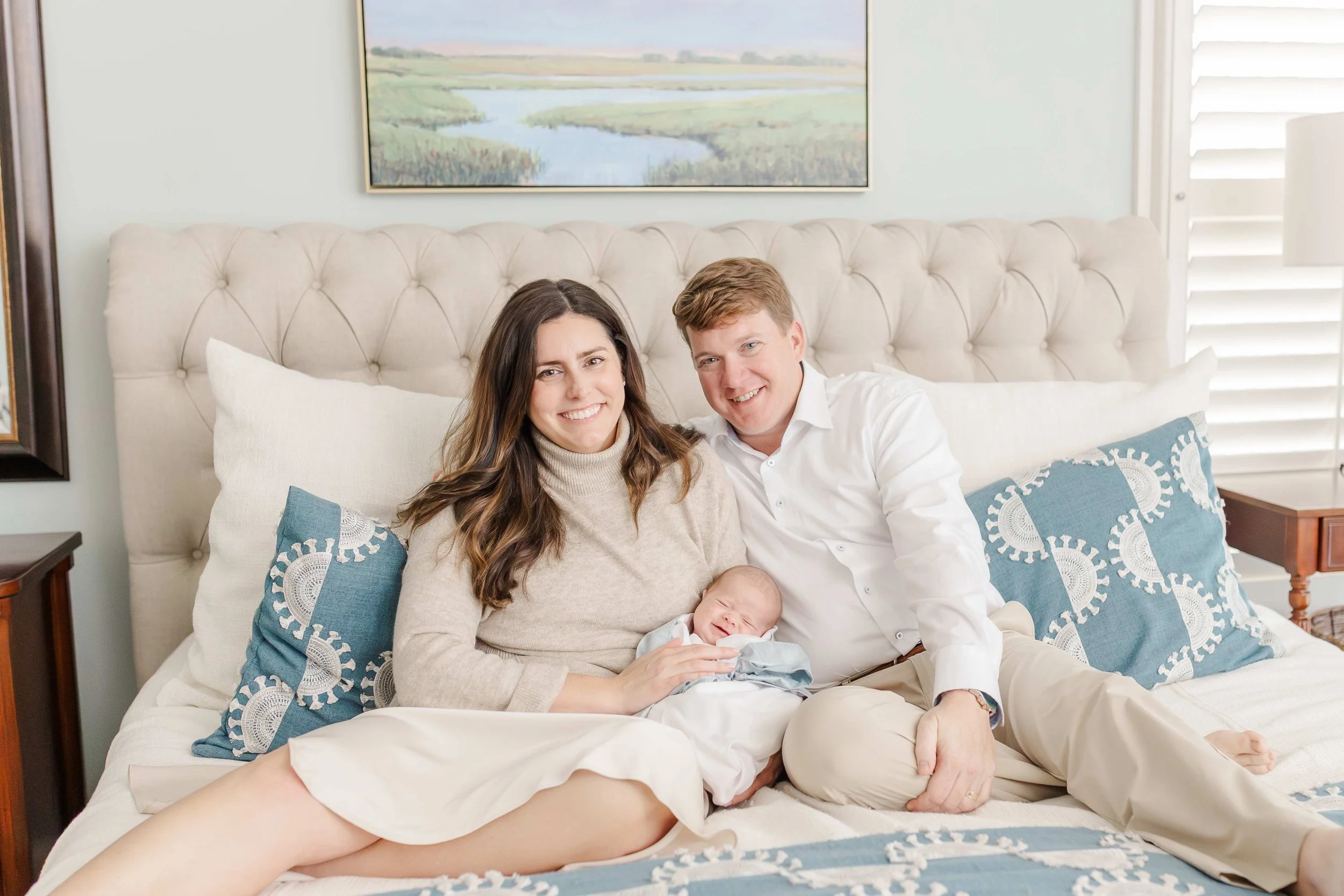 Mom holding newborn baby Thomas in their Laurens, SC home during in-home lifestyle newborn session