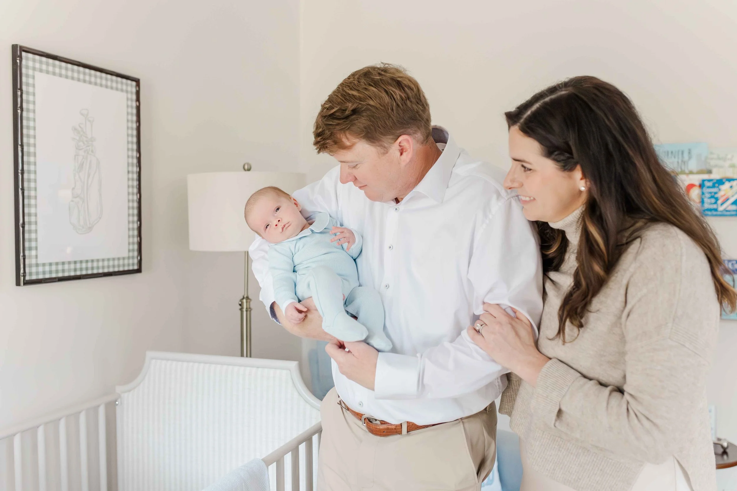 Mom and dad with newborn baby Thomas during lifestyle newborn session in Laurens, SC | Erin Turner Photography