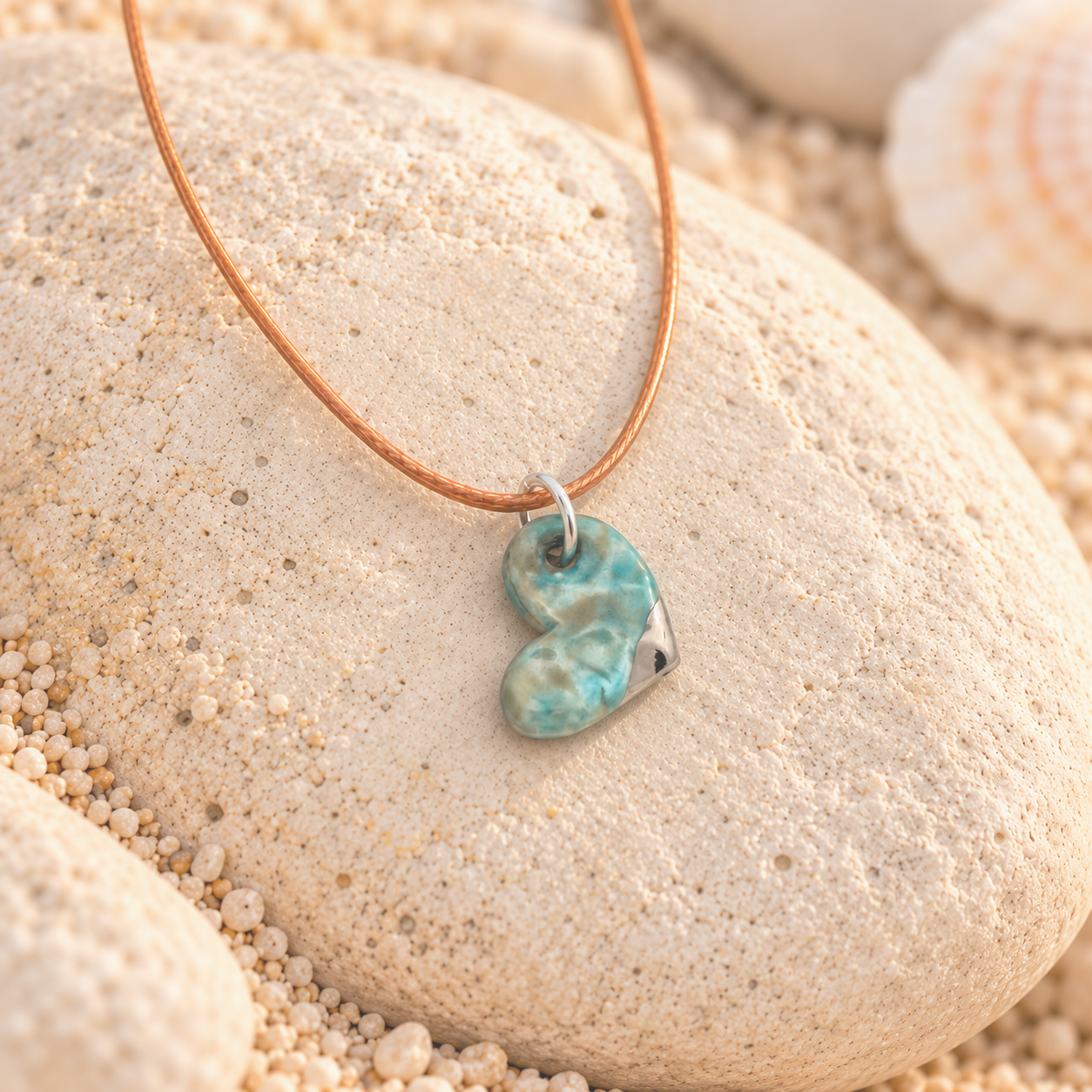 Marbled Turquoise Heart Pendant on Stone.png
