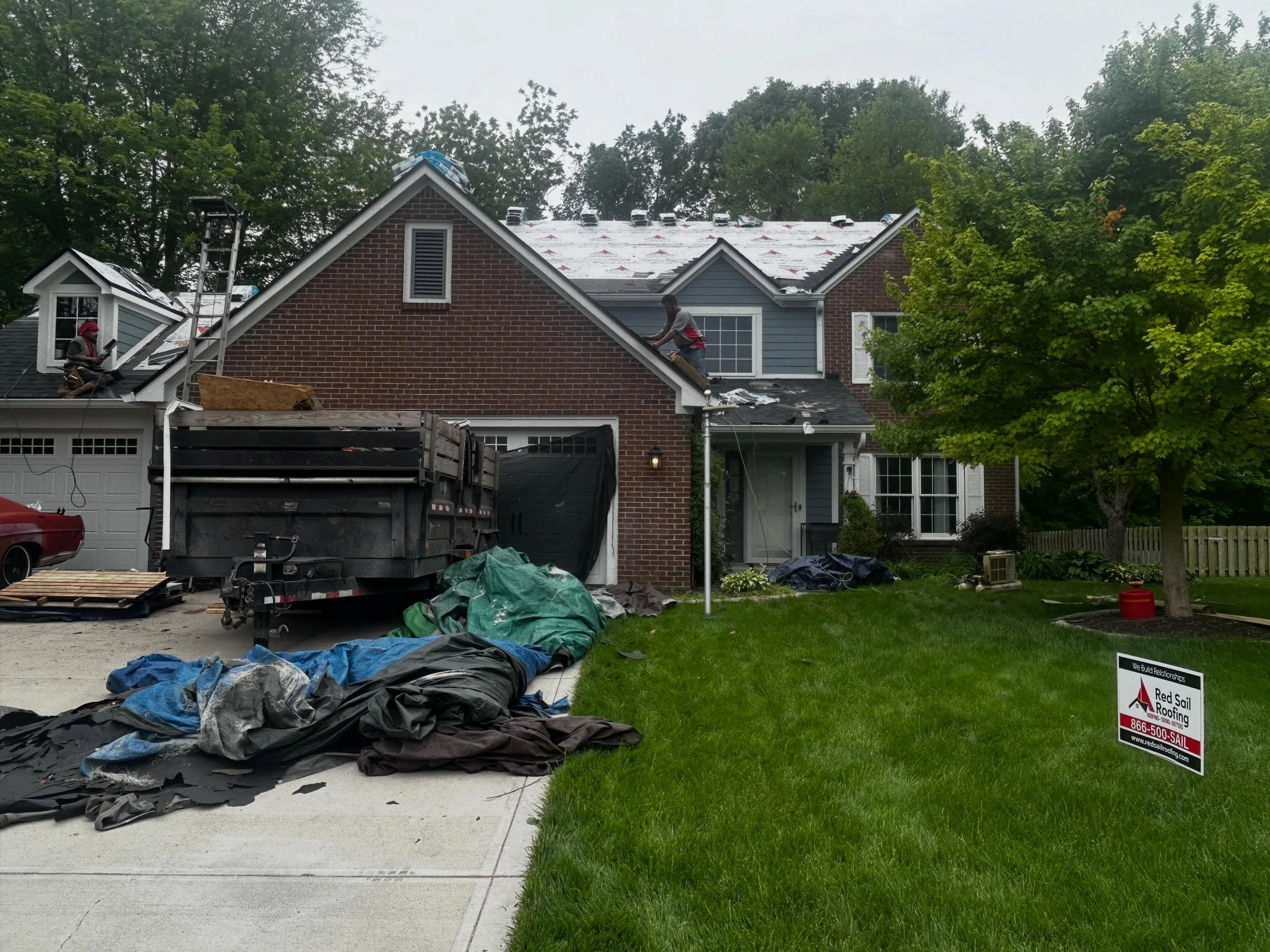 Channeling our Indy 500 spirit as we race against Mother Nature to get this impact resistant shingle installed before tonight&rsquo;s storm 🚩#redsailroofing 🚩
