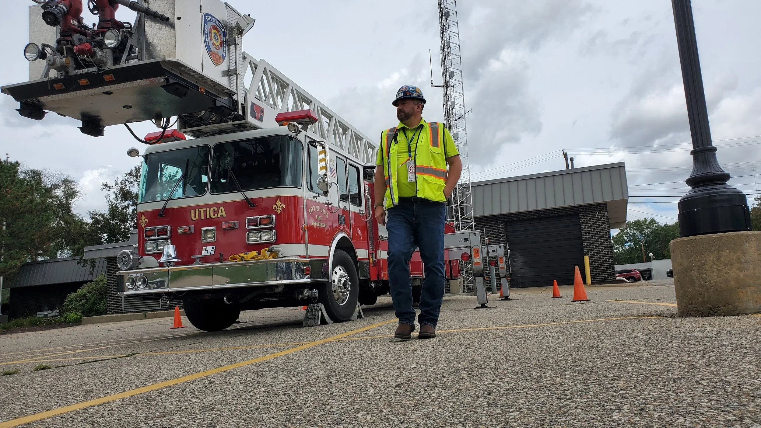 A public safety team communicates via radio in the woods.