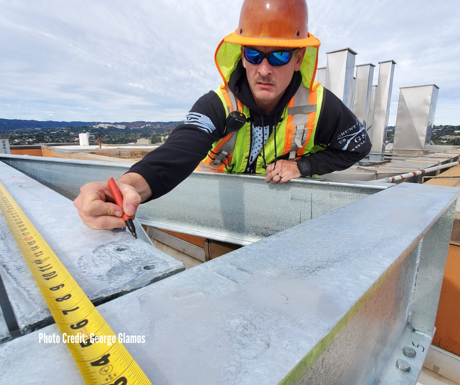 A construction worker manages a project site in a remote location.