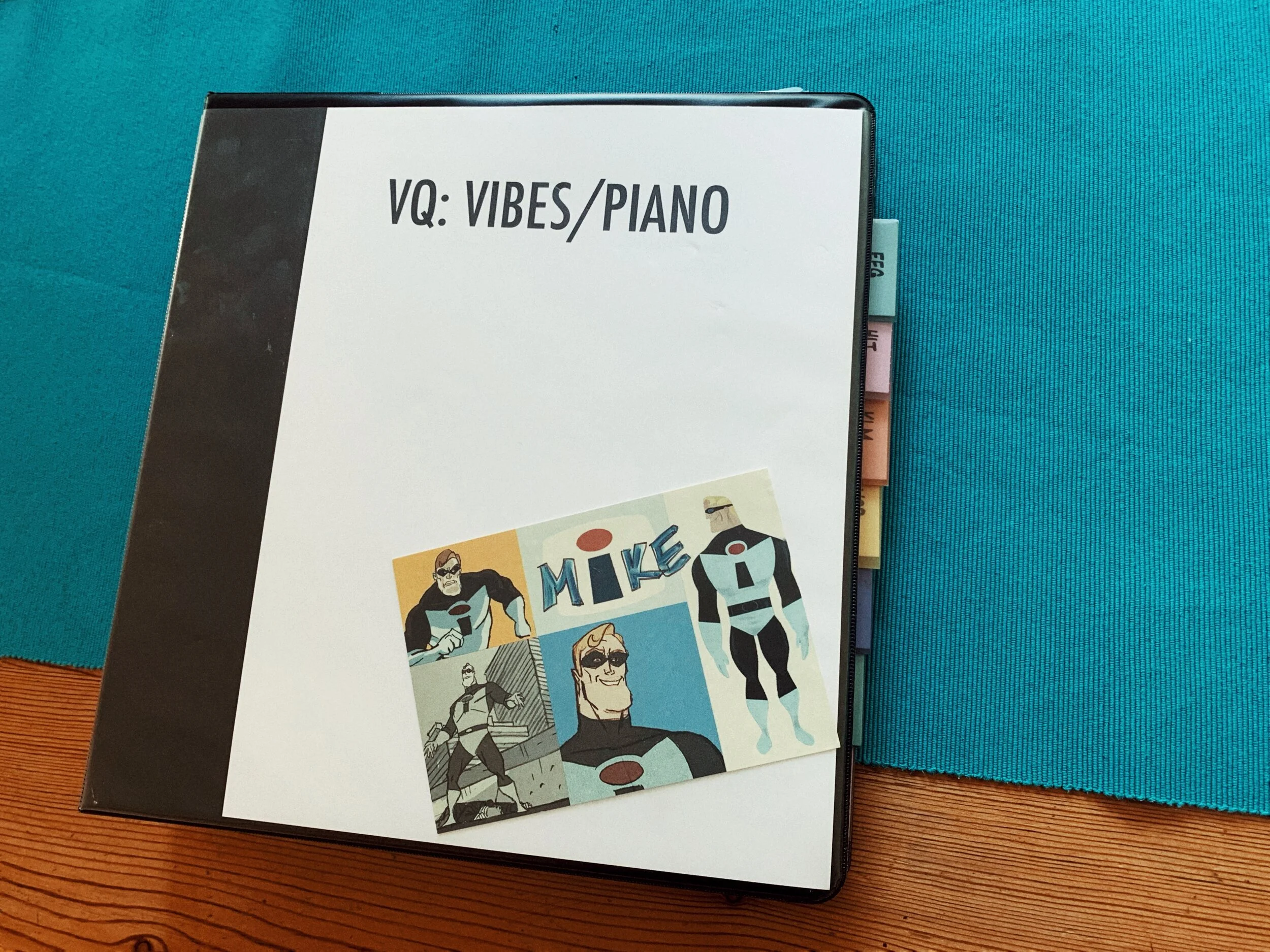 Notebook for jazz quartet with postcard of The Incredibles on it.