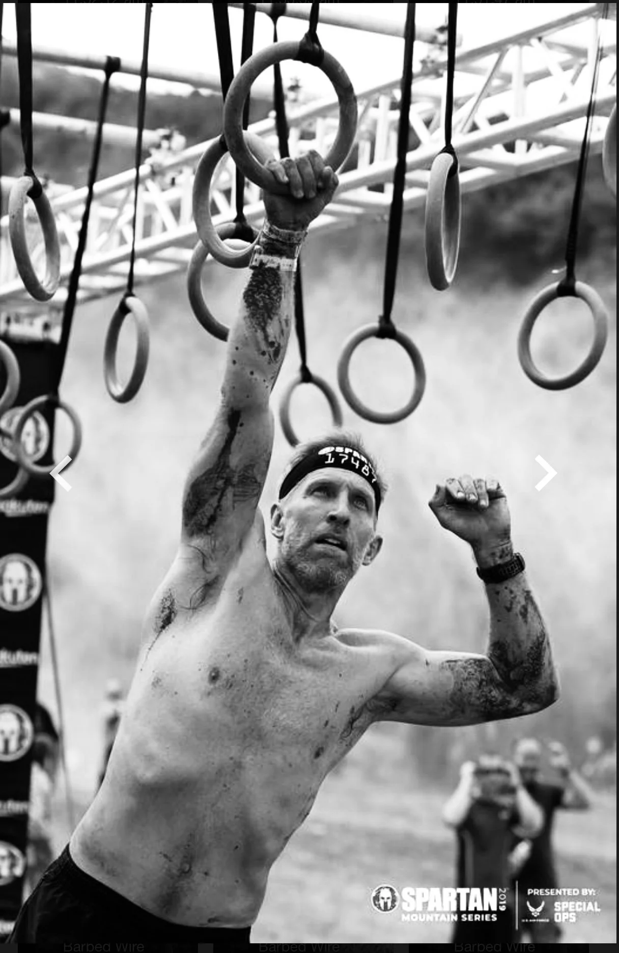 David White swinging on hoops whilst competing in a Spartan Race