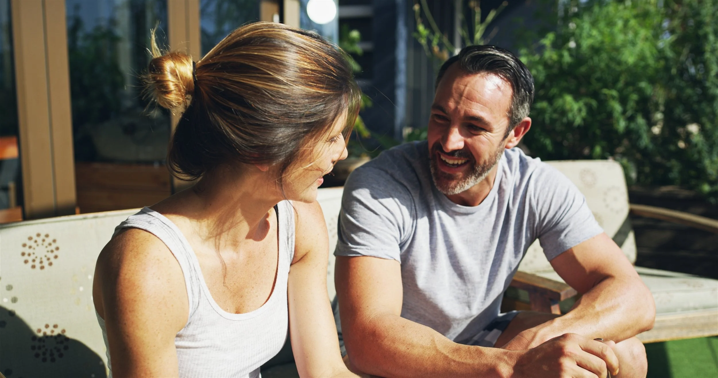 Couple reconnecting through conversation during a relationship integration session in couples counseling.