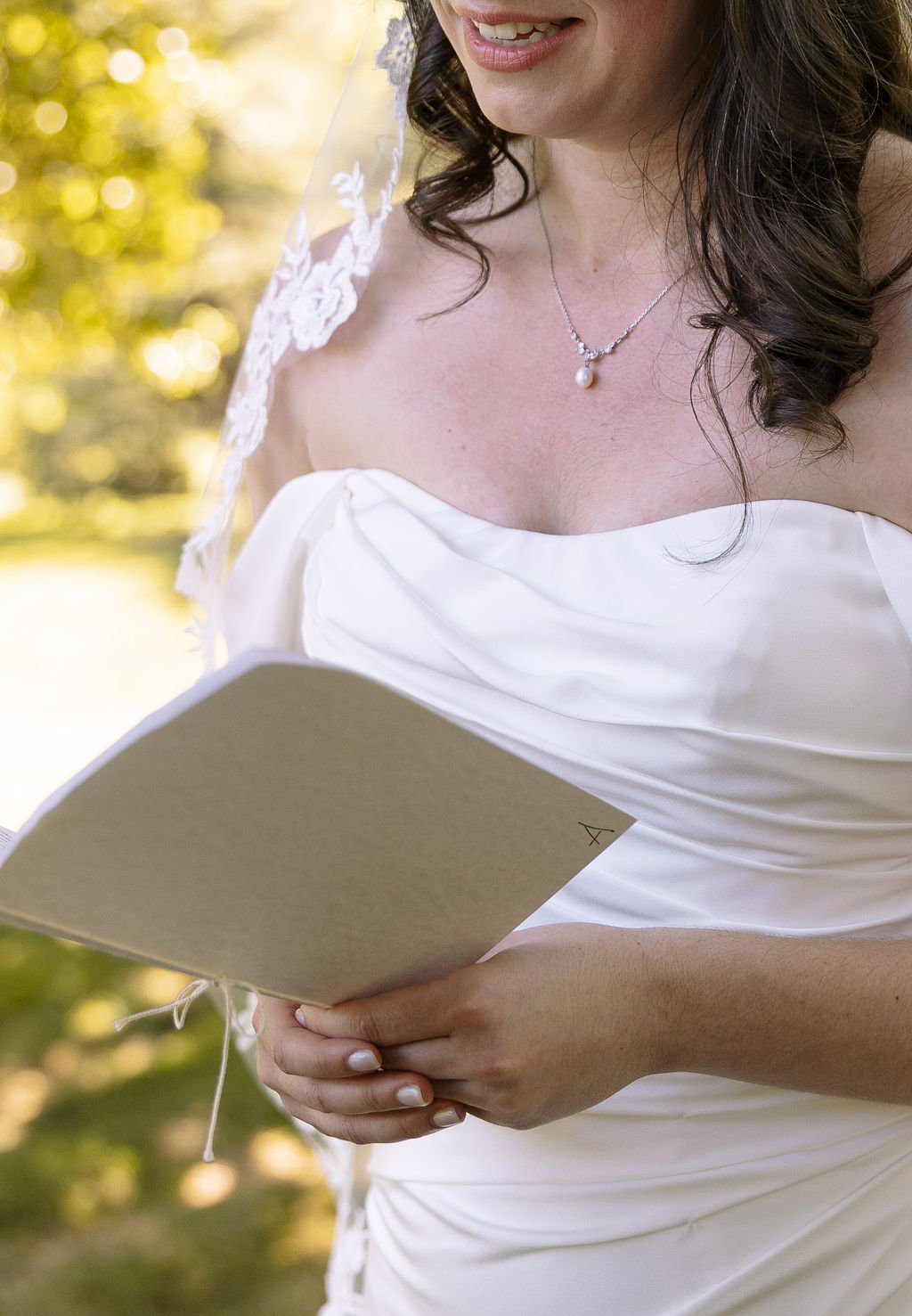 Avia & Jeremiah avia closeup vows booklet.jpg