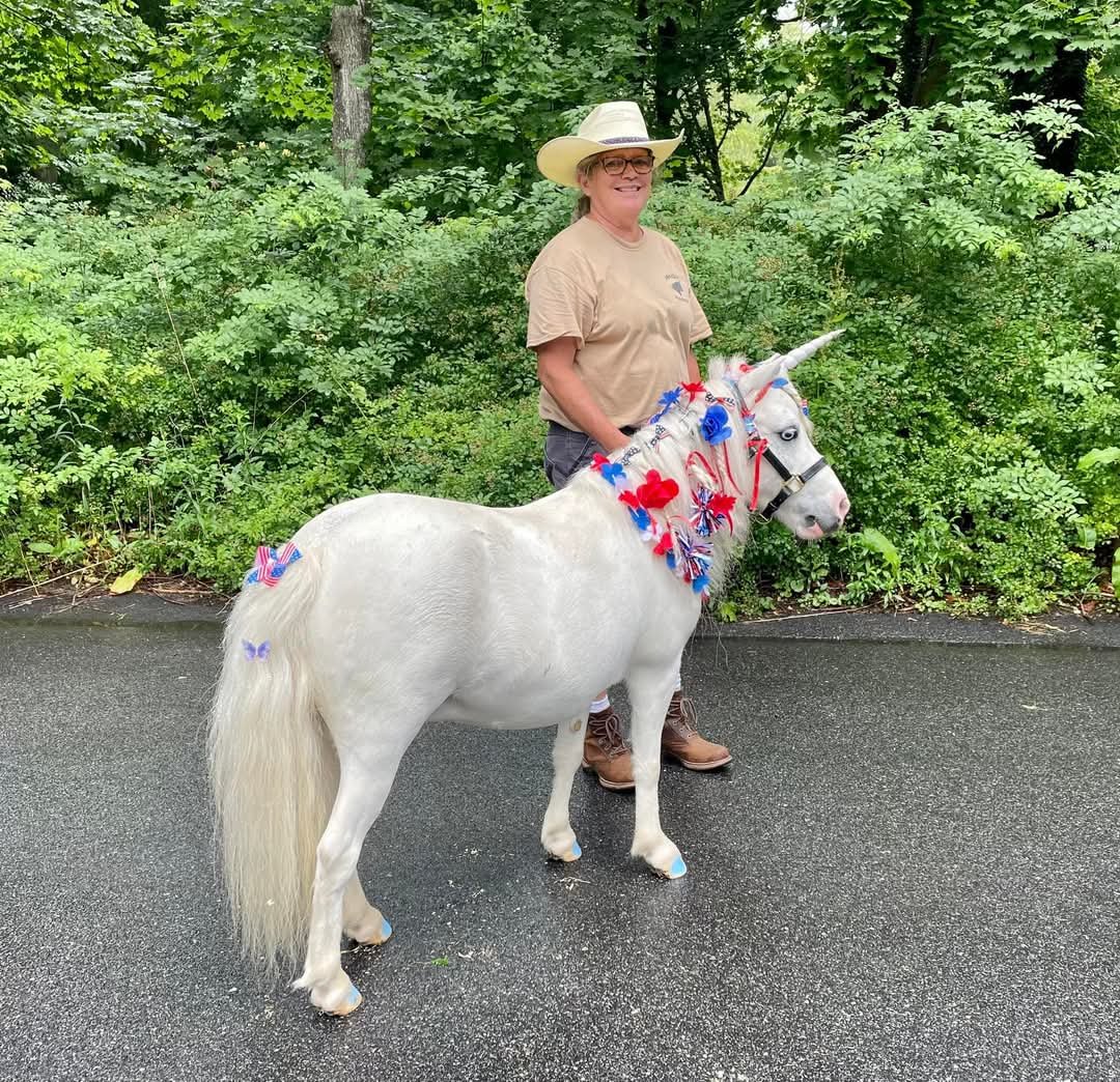 Kate and Precious the Unicorn celebrating Independence Day at the Cotuit parade 2024.