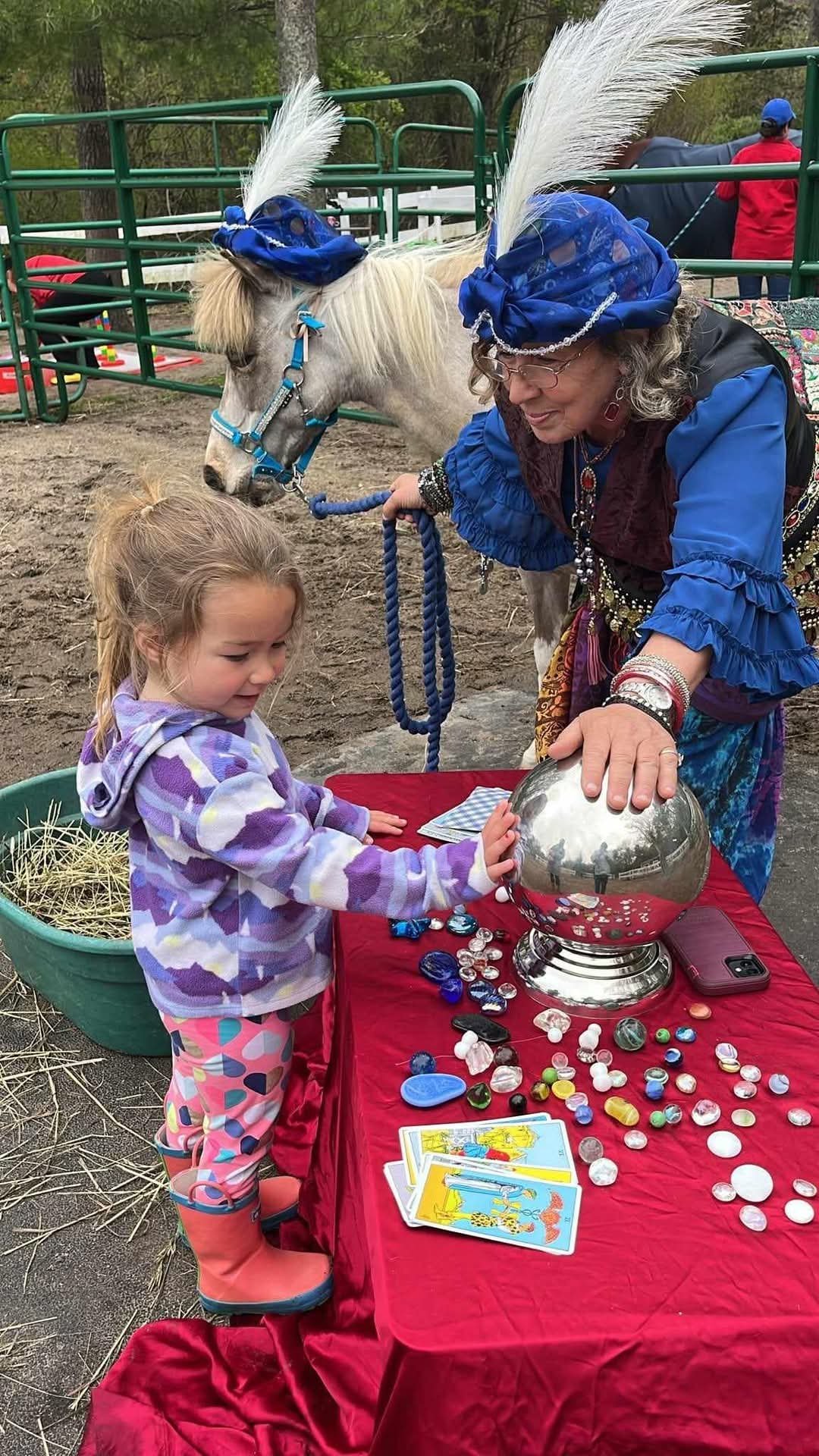 Carnival guest reading Jolie's crystal ball.