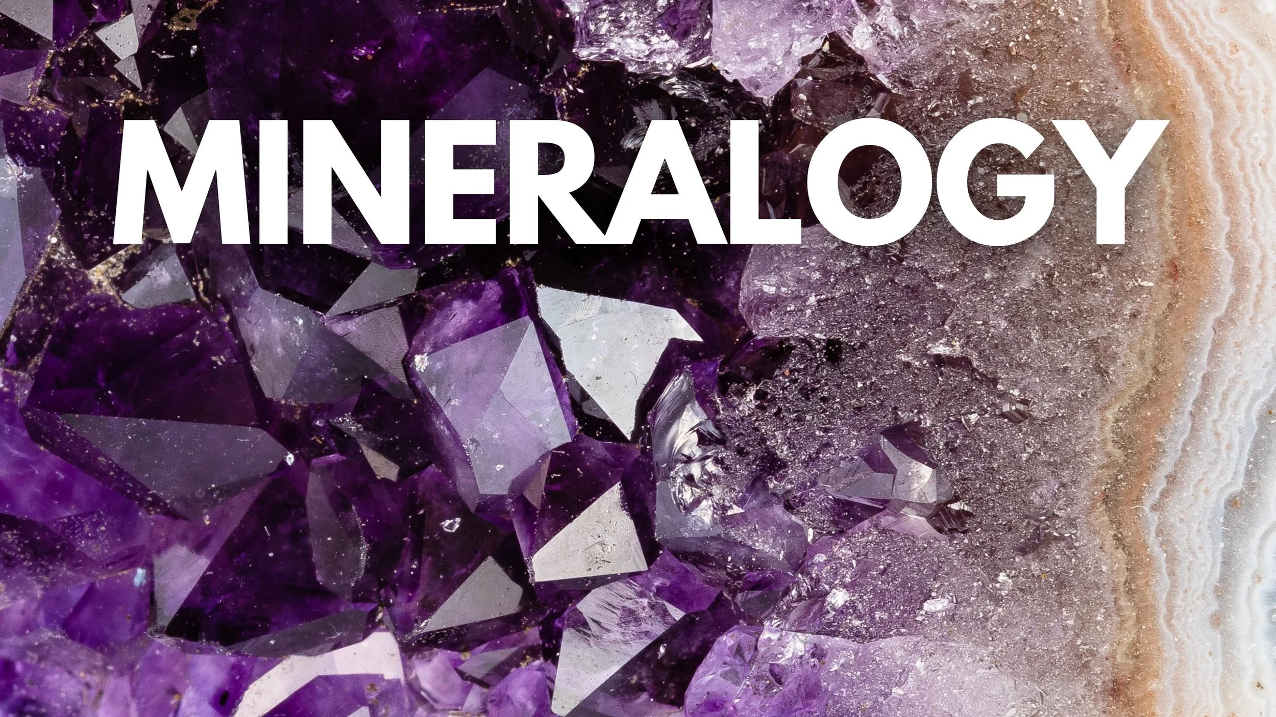 Close-up of purple crystalline mineral with white overlay text that says 'MINERALOGY'.