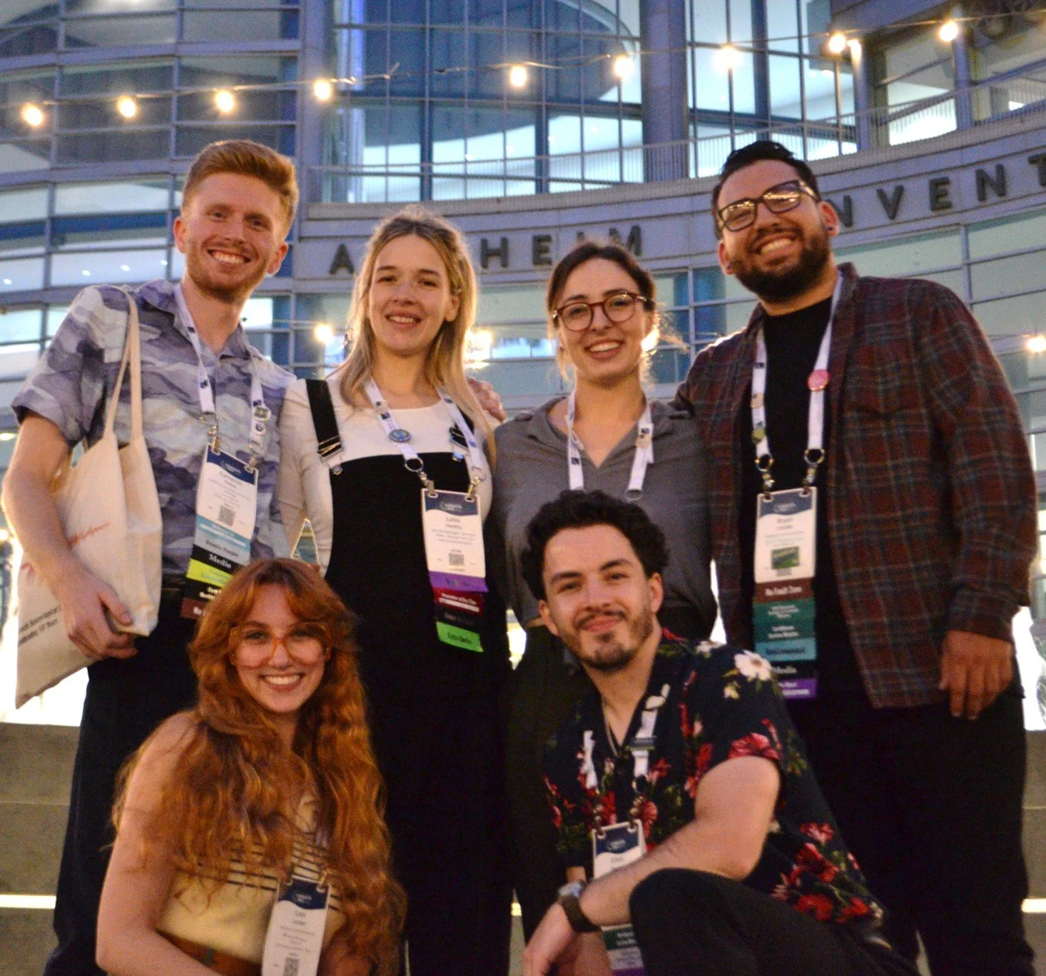 Geoscience communicators, Seismo Cam, Scottish Geologist, Geo Girl, Earthquake Dude, Groovy Geologist, and Rock Man Ethan in group photo outside of GSA Connects geology conference center. 